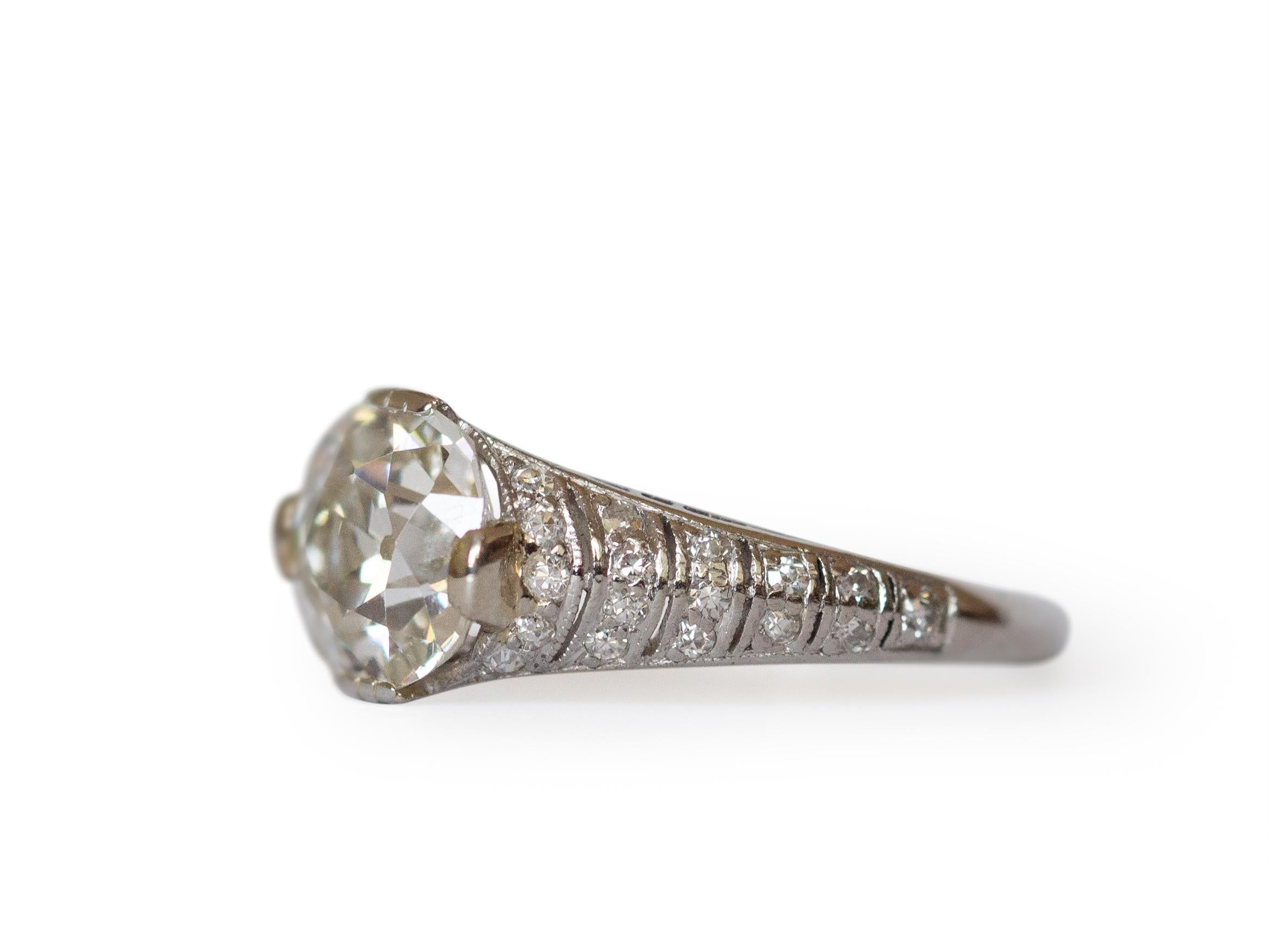 Ring Size: 6
Metal Type: Platinum  [Hallmarked, and Tested]
Weight:  3 grams

Center Diamond Details:
GIA REPORT #:2215028277
Weight: 1.67 carat
Cut: Antique Cushion
Color: I 
Clarity: VS1
Measurement: 7.53 x 7.04 x 4.72

Side Diamond