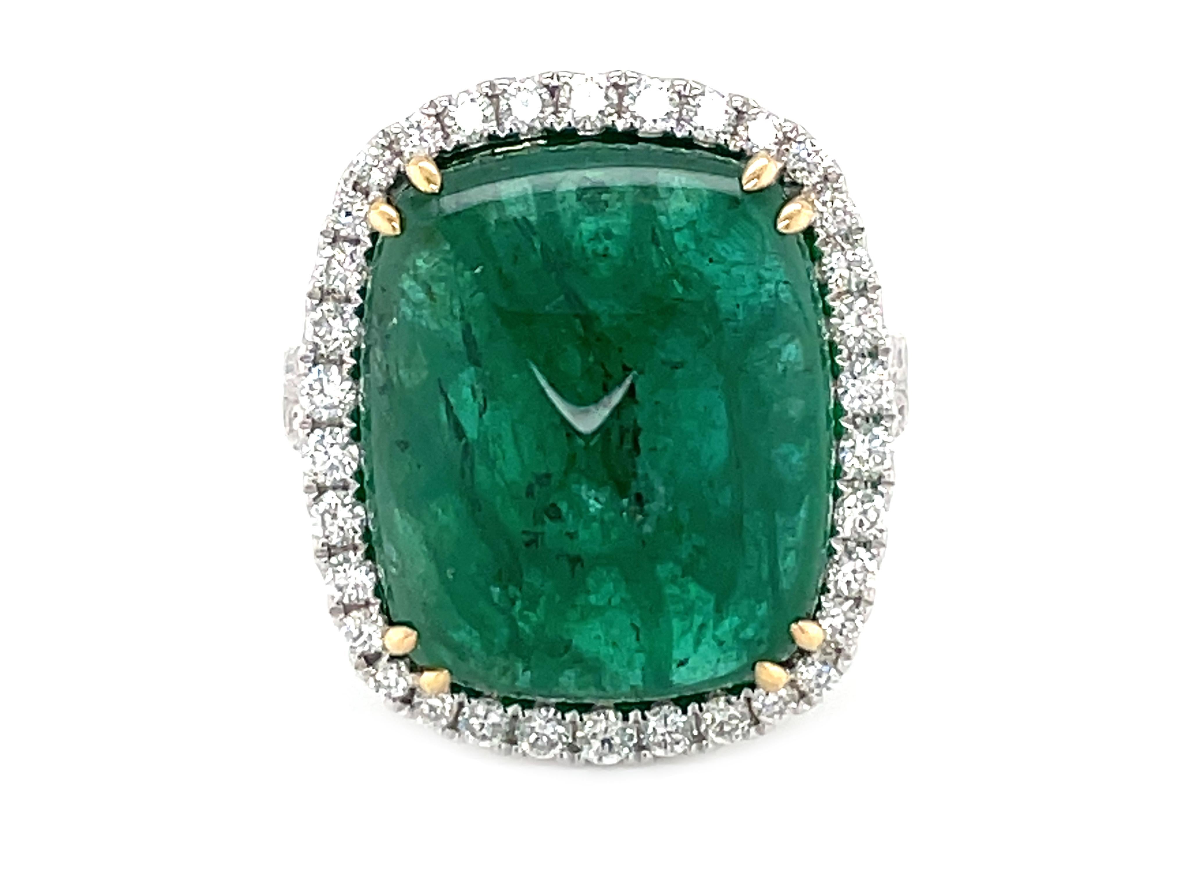 This stunning Cocktail Ring features a beautiful GIA Certified 16.75 Carat Cushion Sugar Loaf Emerald with a Diamond Halo, that sits on a Double Diamond Shank. 

This Ring is set in 18K White Gold, with 18K Yellow Gold prongs on the center