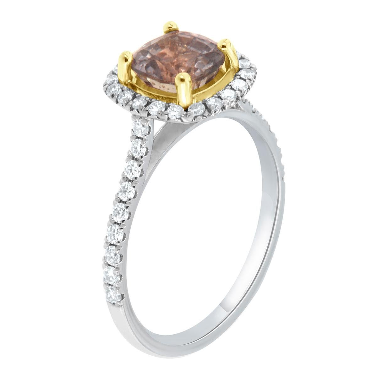 This 18K gold halo ring features perfectly matched brilliant round diamonds 1.5 mm each Micro-Prong set on a 1.8 mm wide shank. In the center of the ring is set one unique natural Sri Lankan No Heat Light Purple Sapphire in an 18k Yellow gold cup.