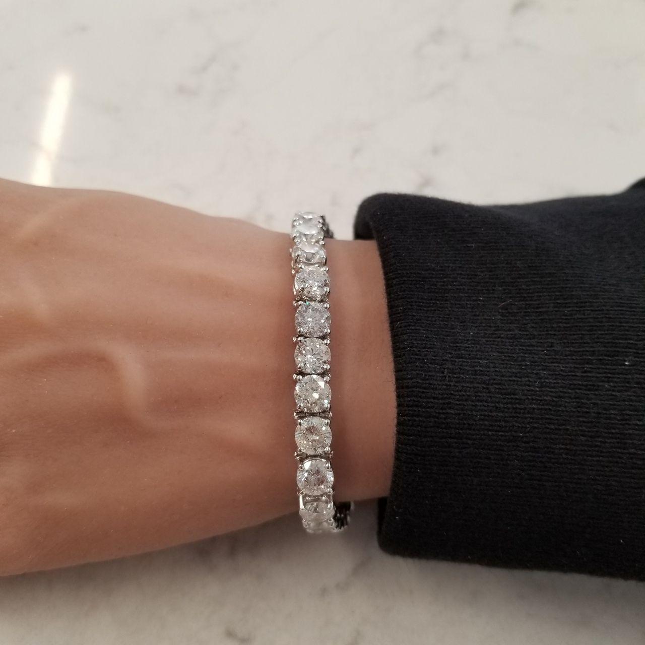 An important bracelet comprising of 33 round brilliant cut diamonds mounted in platinum.
All diamonds are certified with GIA and are of F/G colors, SI2 clarity. 
Total weight of diamonds is 16.80 carats
Platinum weighs 22.9 grams.
6.75 inches long.
