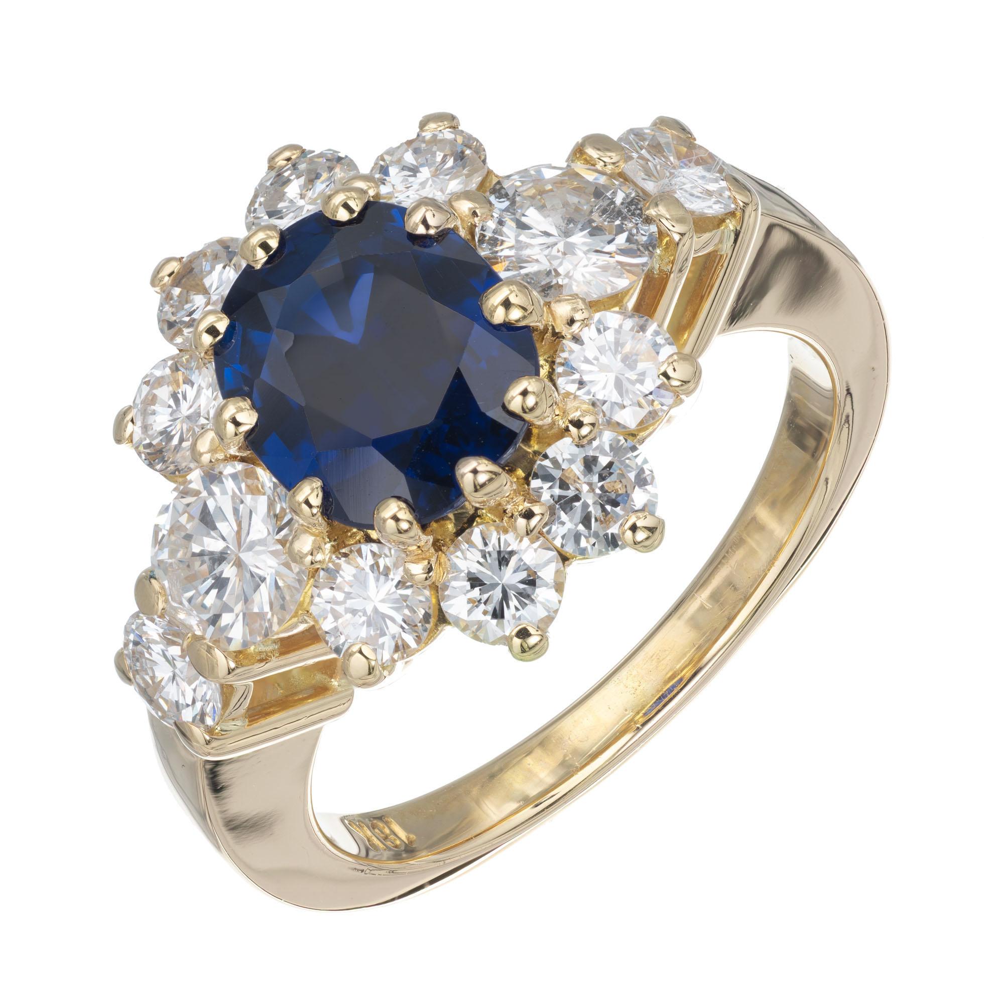 Royal blue 1.69 carat oval sapphire and diamond engagement ring. GIA Certified natural no heat no enhancements center stone, with a halo of round brilliant cut diamonds. 18k yellow gold setting. 

1 oval dark blue sapphire VS, approx. 1.69cts GIA