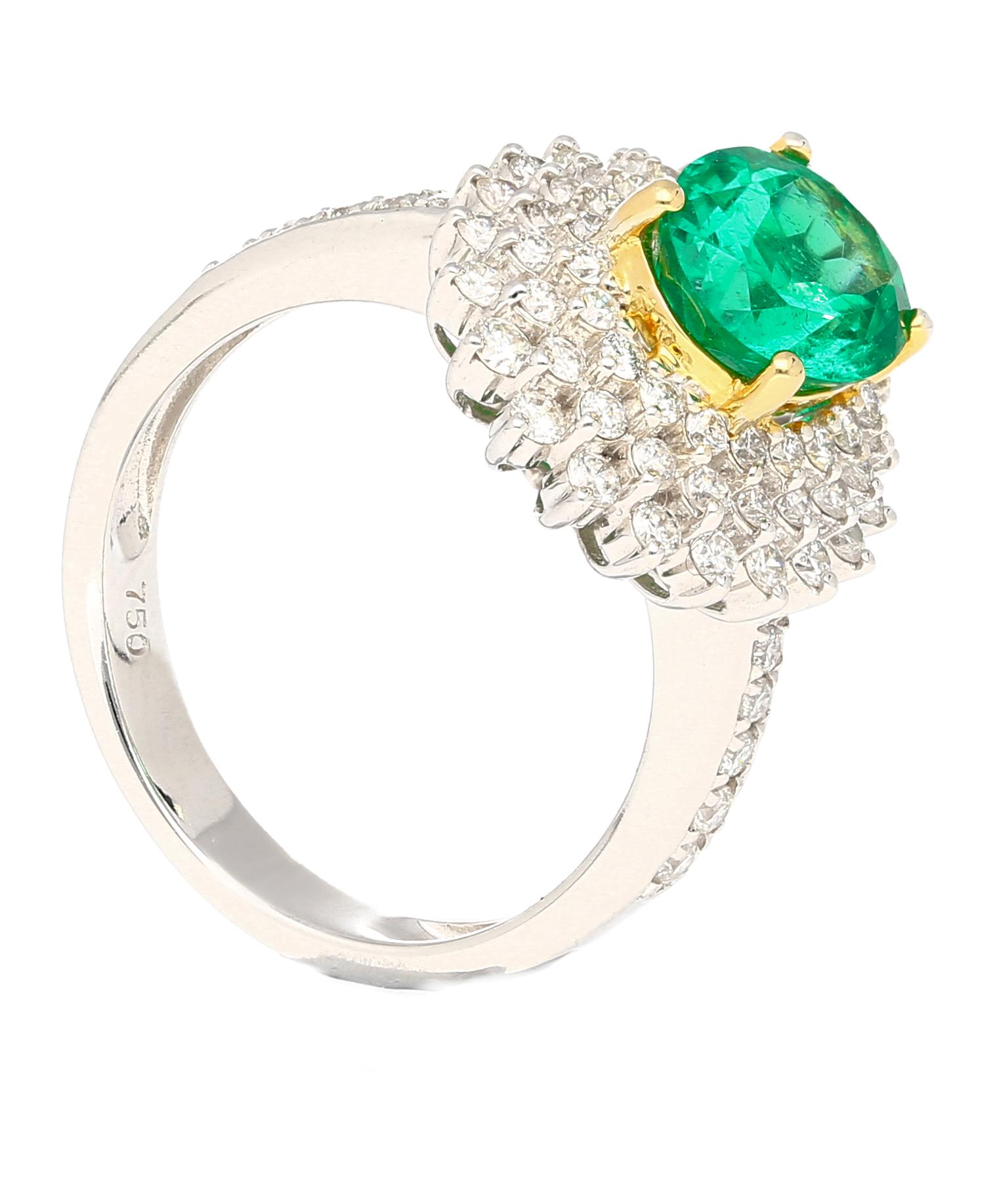 GIA certified 1.76 carat minor oil Colombian emerald and round cut diamond cluster ring. Set in 18 karat solid gold. The ring features a white gold ring shank and frame, with the prongs and basket being yellow gold, offering the perfect color