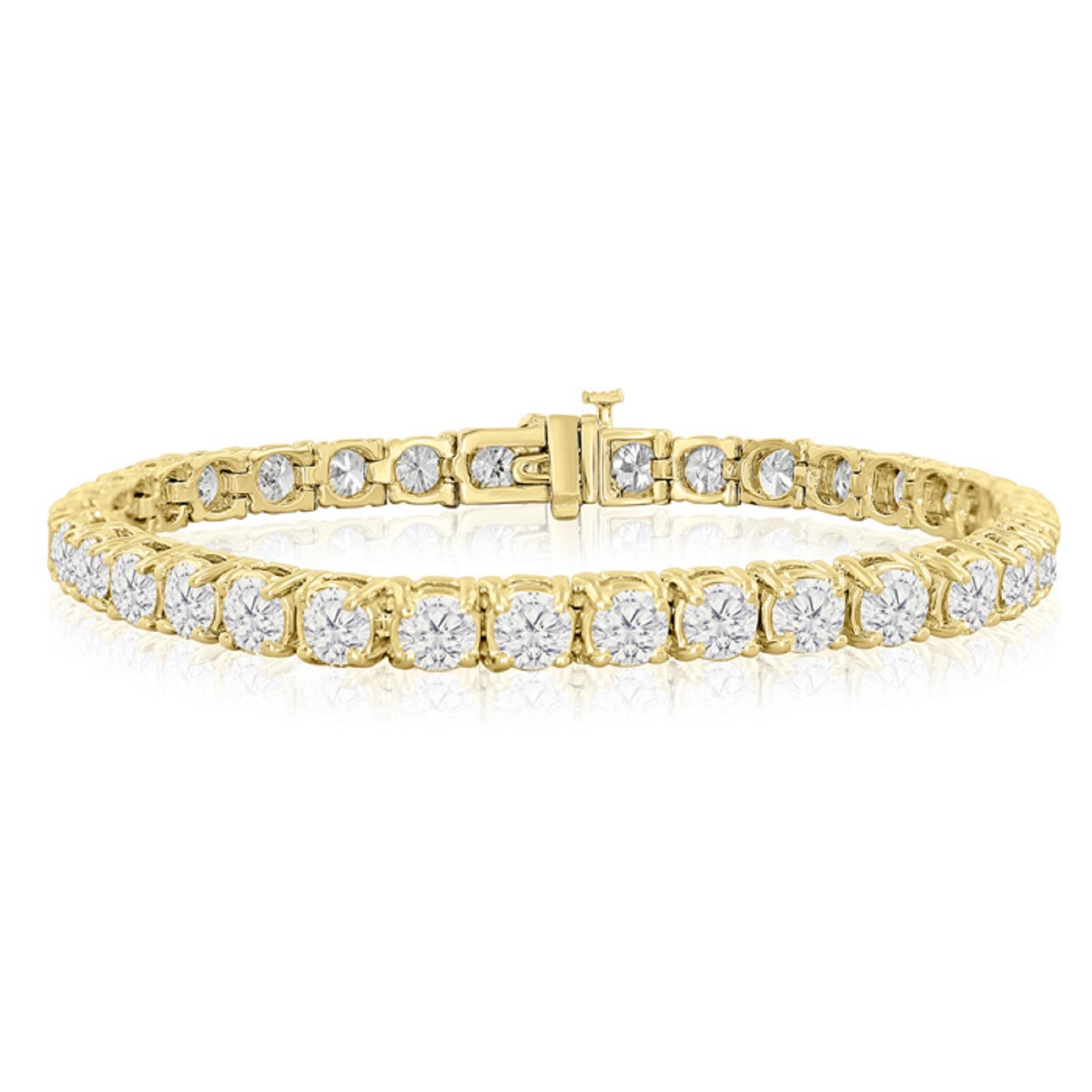 This exquisite tennis bracelet is a testament to timeless elegance and sophistication. Crafted in 18K yellow gold, it features a stunning array of round diamonds meticulously set in a claw prong basket setting, totaling an impressive 17.65 carats in
