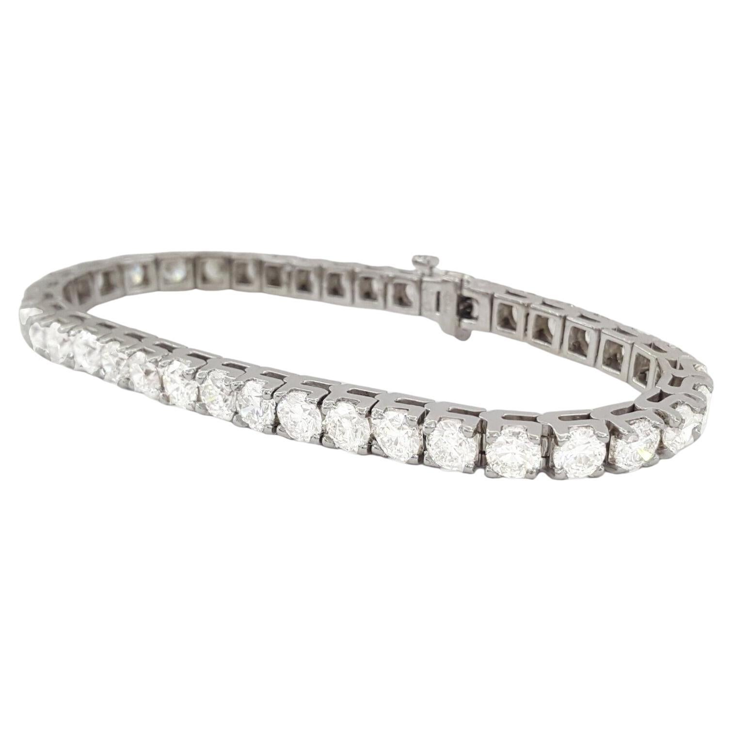 Indulge in the timeless allure of this platinum tennis bracelet, a masterpiece of elegance and sophistication. Crafted with meticulous attention to detail, it showcases a mesmerizing collection of round diamonds totaling 17.03 carats in weight.
Each