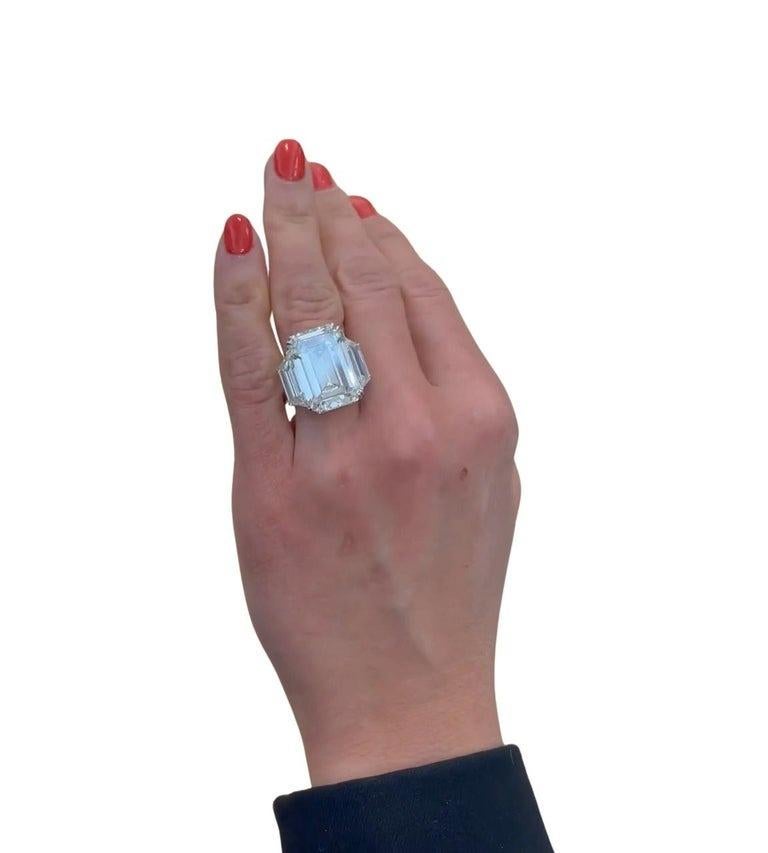 A GIA Certified 17-carat Emerald Cut Diamond Platinum Ring, complemented by J color, VS2 clarity trapezoid side stones, creates a striking and balanced look. The emerald cut's step facets combined with the brilliance of high-color, high-clarity