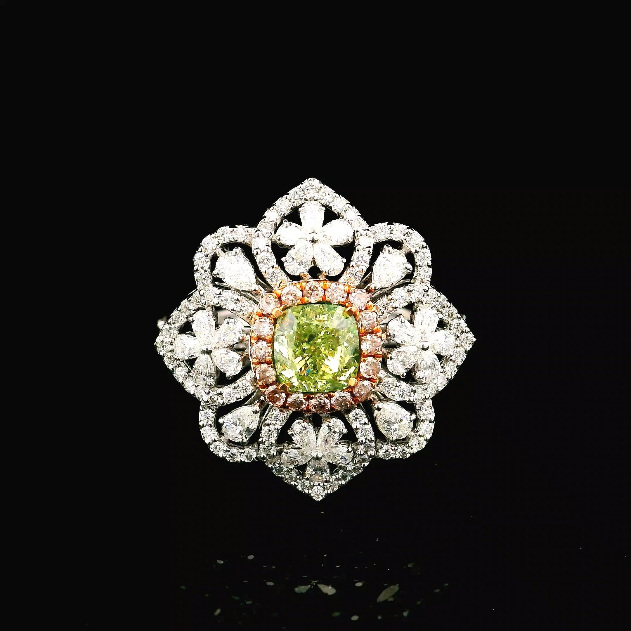 18kt white gold ring with diamonds
  
  Gold colour & karat: White gold 18kt
  Weight: 8.11 grams
  
  Set with-
  Stone type: Diamonds
  Shape: Cushion
  Carat: 1.70 ct
  Colour: Fancy Brownish Greenish Yellow
  Clarity: VVS2
  
  Surrounding