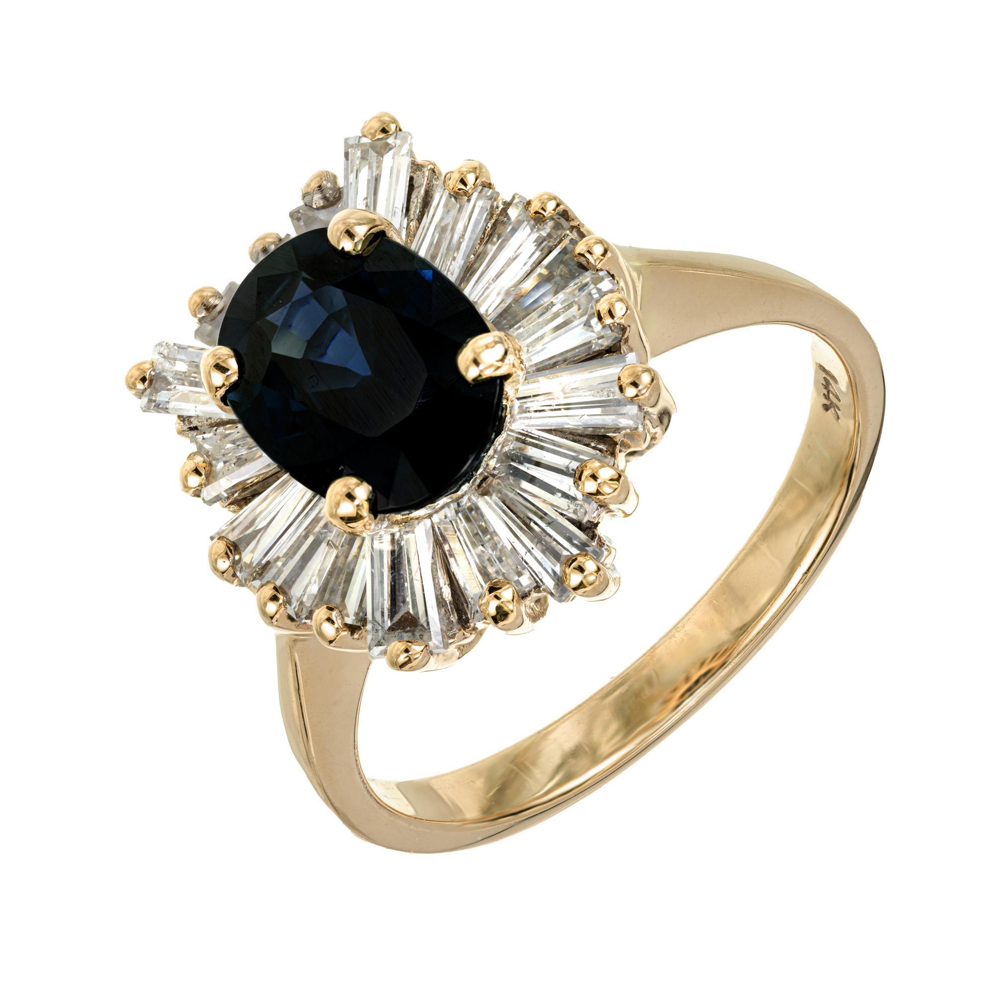Vintage 1960's sapphire and diamond ballerina engagement ring. This deep blue oval 1.70ct sapphire is GIA certified natural, no heat, mounted in a 14k yellow gold setting with a halo of 18 tappered baguette diamonds, totaling 1.20cts.

1 oval blue