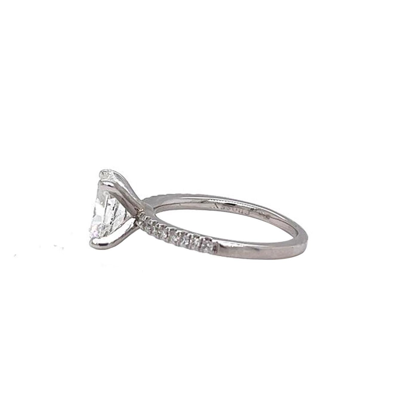 This Oval Diamond ring is accompanied by a GIA Certified report certifying that the 1.70 Carat Cushion Cut Si2 clarity I color Diamond Ring is made in Platinum with 0.55ctw Pave Natural Diamonds. This beautiful diamond ring is ideal for your special