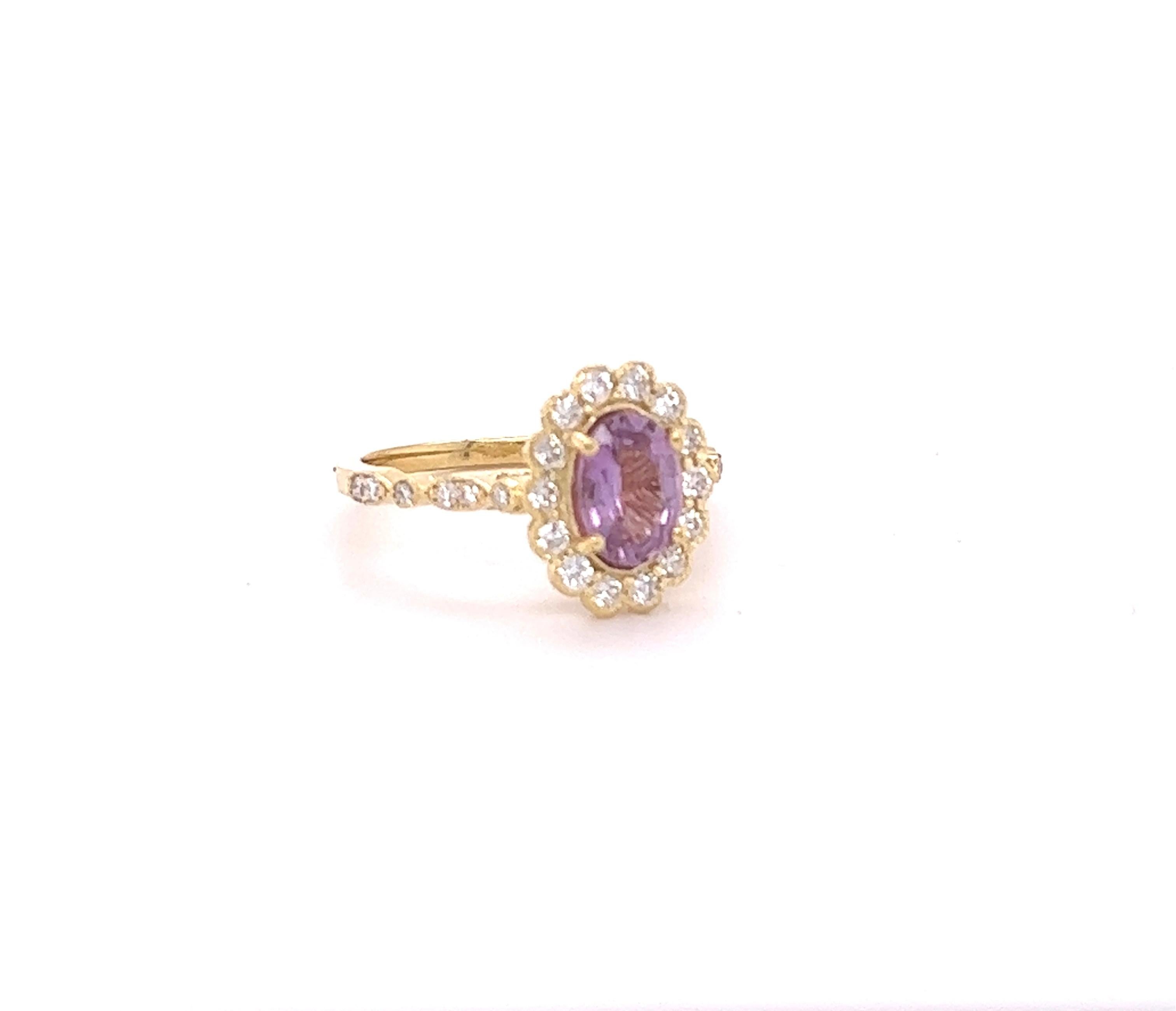 This beautiful ring has a Natural Oval Cut Purplish Pink Sapphire that weights 1.22 Carats. 

The ring is embellished with 26 Round Cut Diamonds that weigh 0.49 Carats with a clarity and color of VS/H. 
The total carat weight of the ring is 1.71
