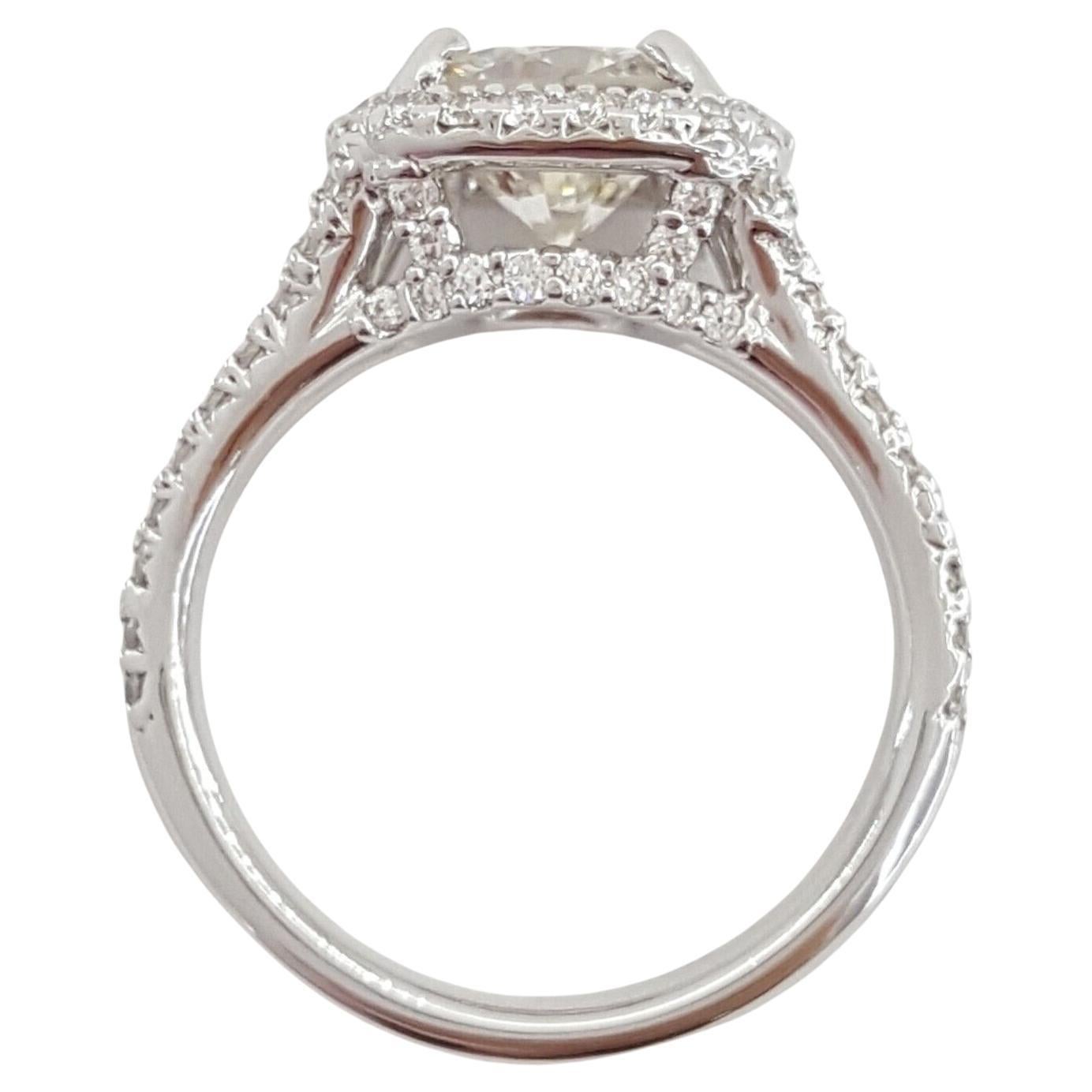 Introducing a remarkable 2.63-carat Total Weight Round Brilliant Cut Diamond Halo Split Shank Engagement Ring, elegantly crafted in 18k White Gold.

This exquisite ring possesses a total weight of 5.2 grams and is designed in a size 4.75. The focal