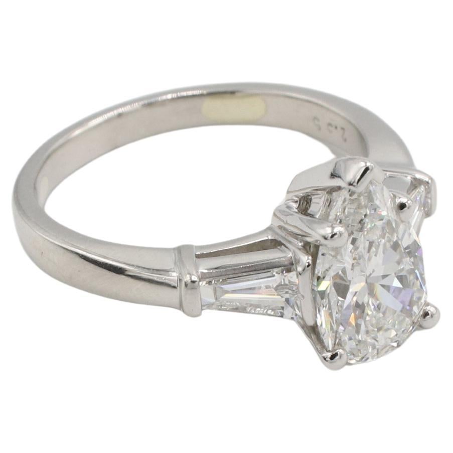 GIA Certified 1.72 Carat G SI1 Pear Shape Natural Diamond Platinum Engagement Ring 

GIA report number: 5234387868
Diamond: 1.72 carat G SI1 pear shape natural diamond
Accent diamonds: 2 tapered baguette natural diamonds, approx. .50 CTW G
