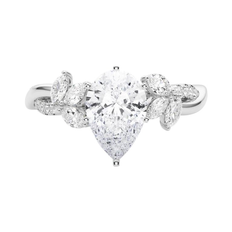 Anello con diamante in platino certificato GIA da 1.72 carati con pera intrecciata e fiore da giardino.