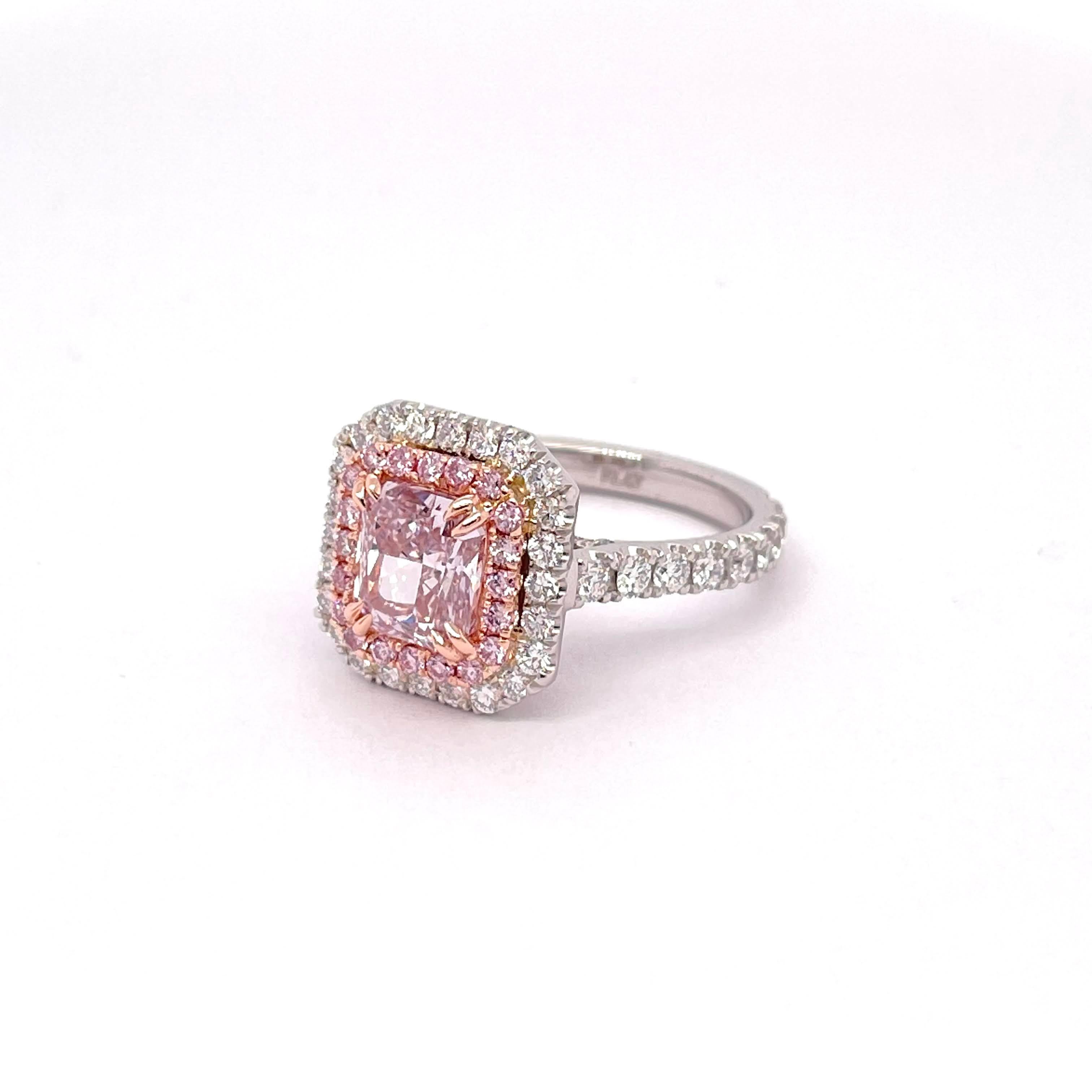 GIA Certified Radiant Shape Cut Diamond 1.74, Fancy Purplish Pink Color VS2 Clarity wrapping it with an inner halo made of 0.24 carats pink diamonds which give the beautiful illusion of a bigger center stone and an outer halo and shank made of 1.26