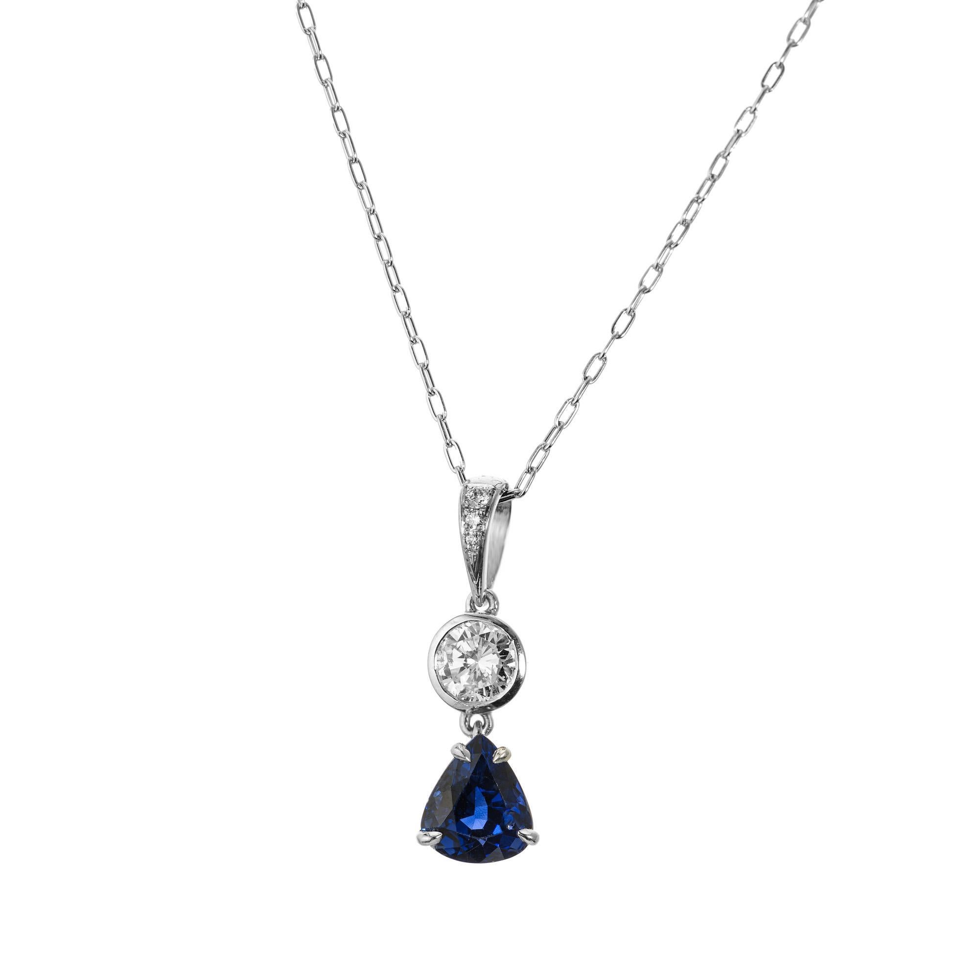 Natural Blue pear sapphire and diamond pendant necklace. The center piece of this necklace is the 1.74ct pear shaped blue sapphire accented by a round brilliant cut bezel set diamond. The bezel is also adorned with three full cut diamonds. The