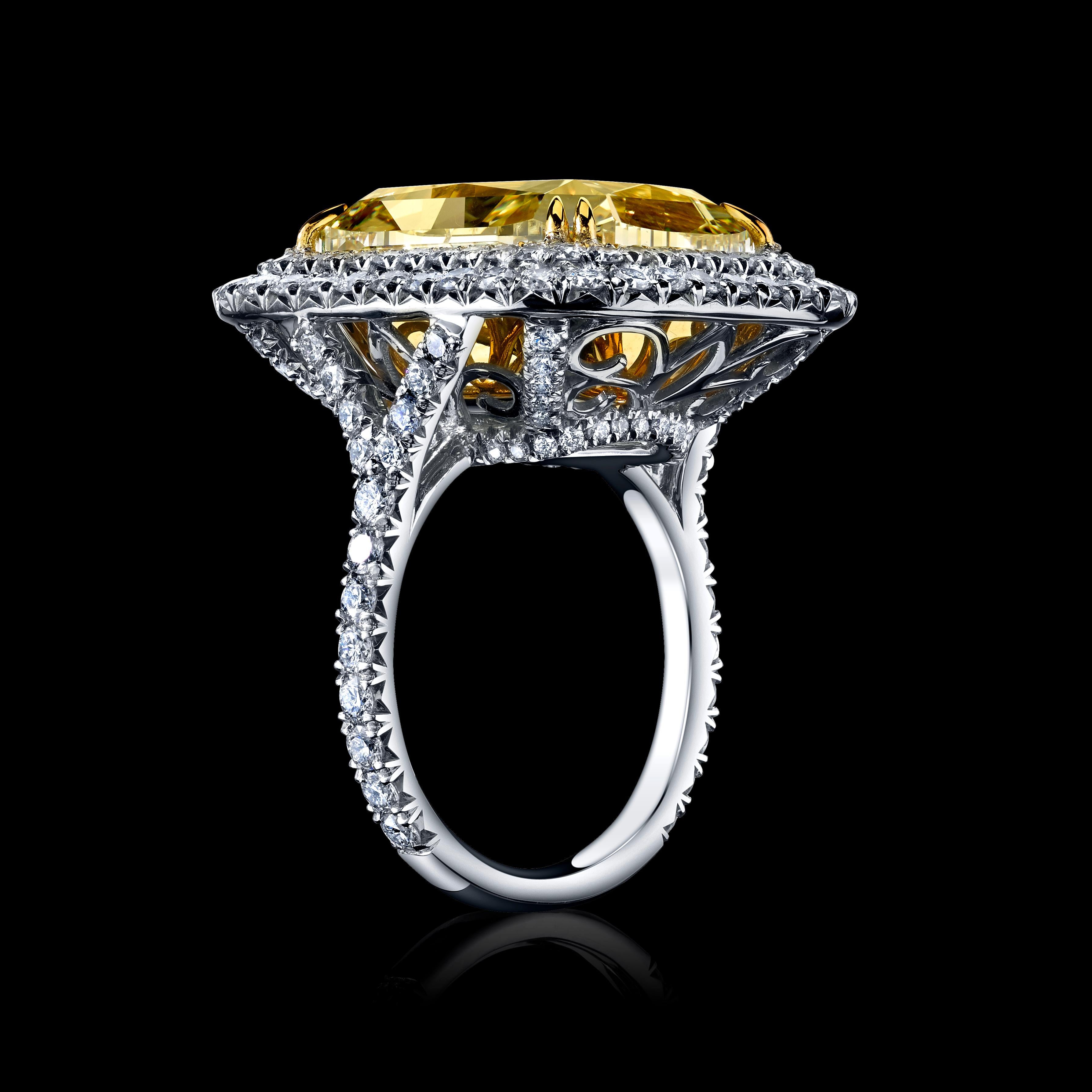This classically designed ring will take your breath away.

A stunning 17.49ct Cushion Fancy Light Yellow Natural Diamond with 2 Tapered Baguettes totaling 0.96cts set in Platinum & 18K Yellow Gold.

This diamond has two different settings - choose