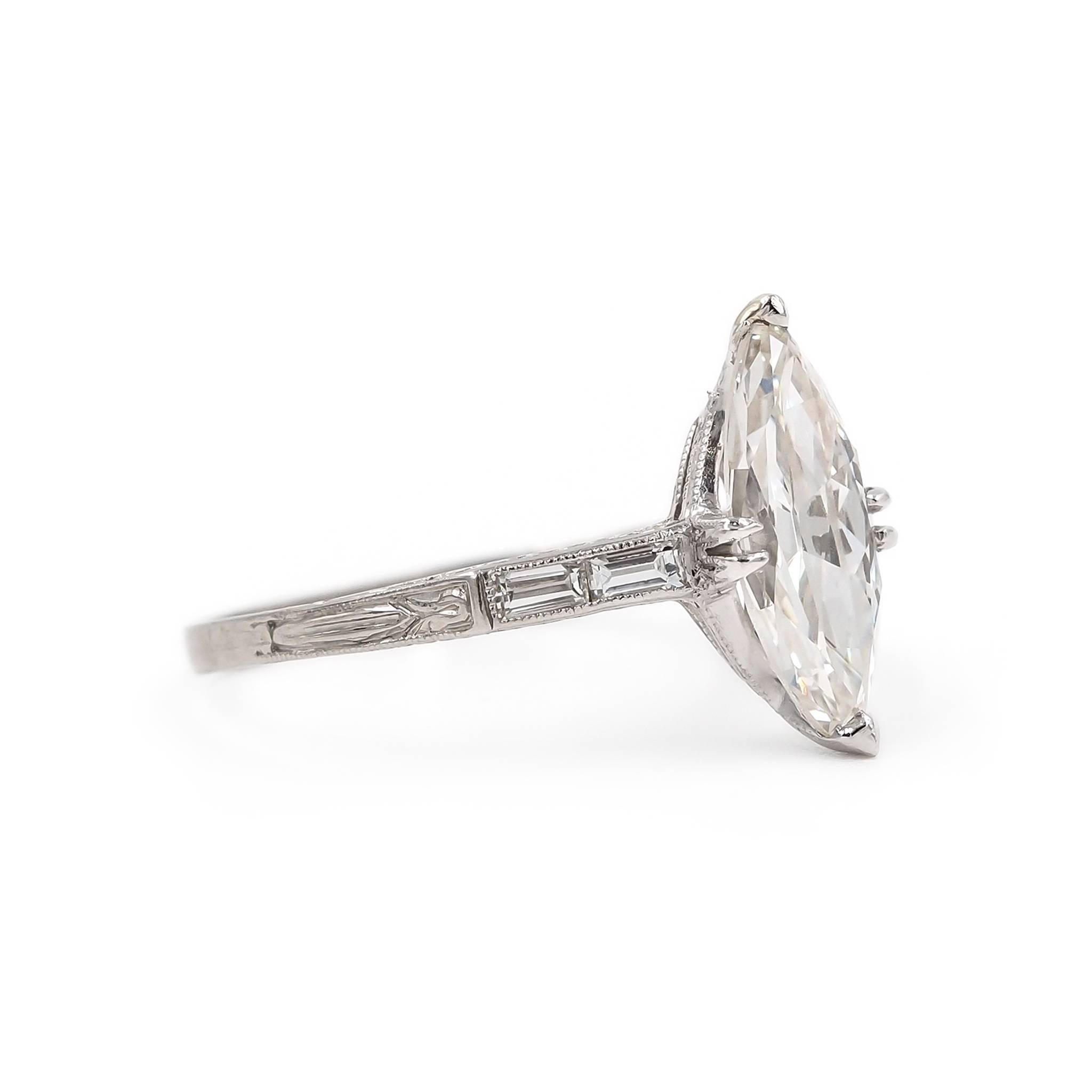 Classic Art Deco handcrafted design in platinum. This Art Deco era engagement ring (circa 1930) features a center stone 1.75 Carat Antique Marquise Cut Diamond. Accented with 4 Straight Baguette Cut Diamonds (2 on each side) weighing 0.12 Ct. in