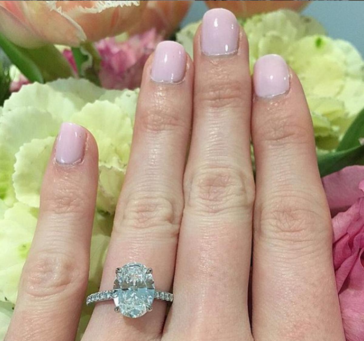 This eye-catching 2 carat GIA certified oval cut diamond ring that has excellent G color, a completely eye clean appearance, and gorgeous, lively brilliance! Oval cuts are one of the most fashionable and sought after diamond cuts, and its elongated
