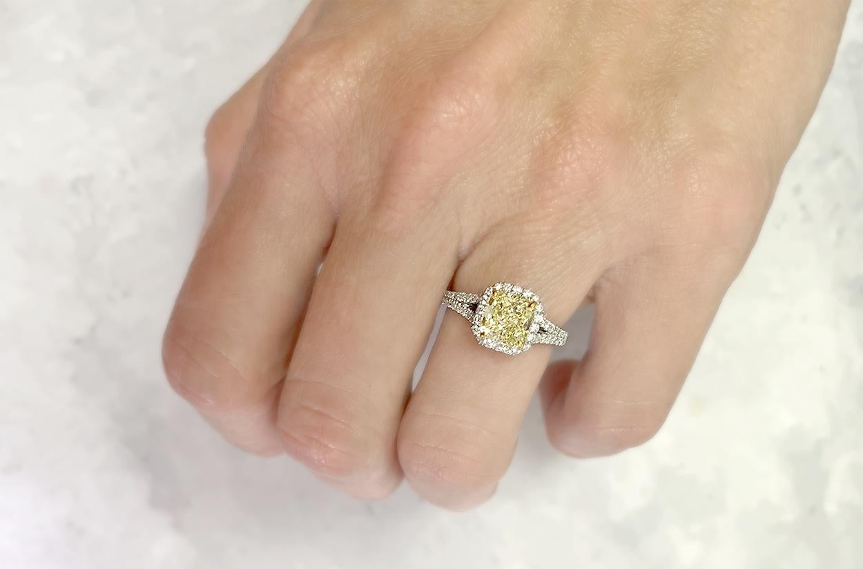 Crafted from Platinum the magnificent engagement ring comes enriched with 1.76 carats Cut-Cornered Square Fancy Yellow Diamond Clarity VS2 GIA #1166372500 and Pave Diamonds 0.40 carats Split Shank. Size 6.
 resulting in a captivating and luxurious
