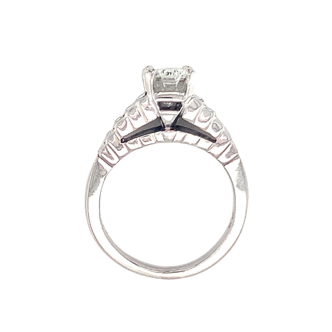 One GIA certified 1.79 ct. diamond platinum engagement ring centering one prong set, radiant cut diamond weighing 1.79 ct. with H color and VVS-2 clarity. The ring is enhanced with a tiered baguette cut diamond design with ten baguette diamonds