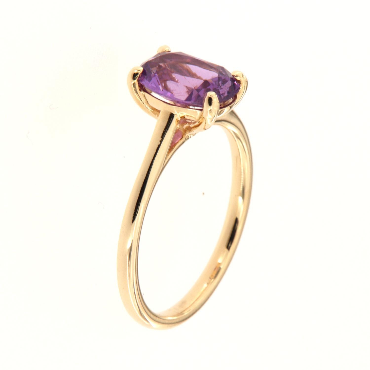 This 14k yellow gold solitaire ring features an Oval shape 1.79-carat Non-Heated Natural Pink-Purple Sapphire four prong set on a 1.7 mm wide band. The sapphire exhibits an excellent luster. It is GIA certified number. 6214628502 
The ring size is