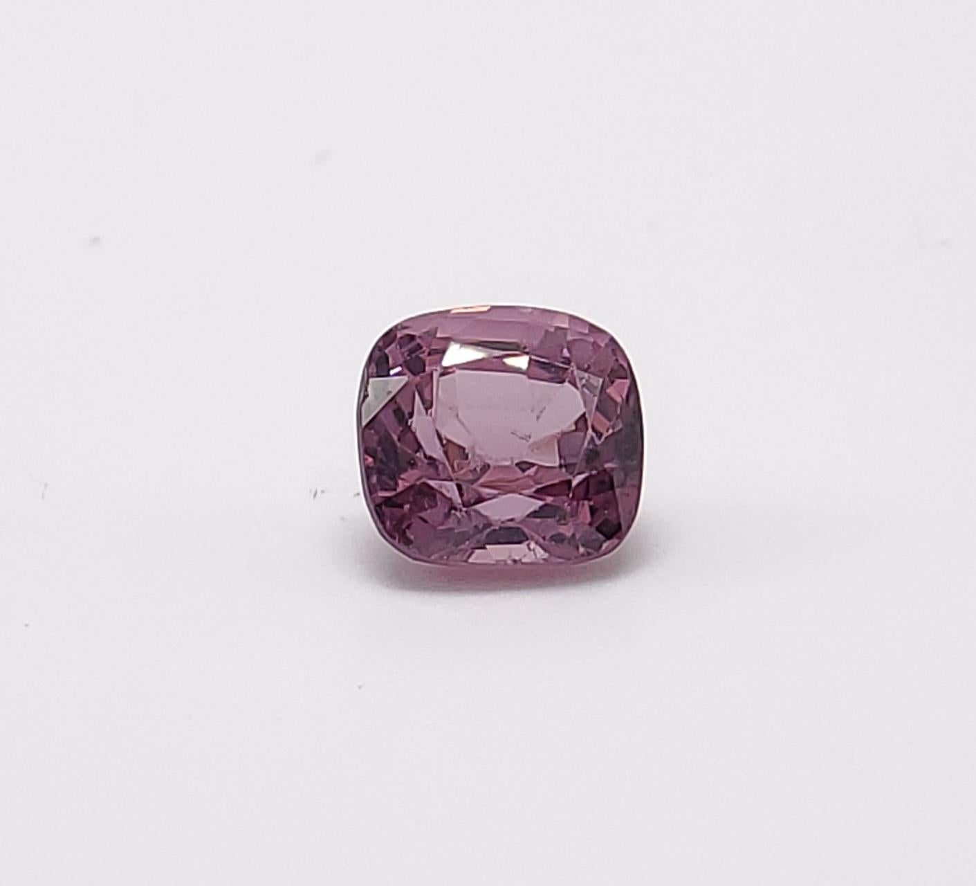 This pretty Purple-Pink spinel  Cushion cut , weighs 1.79 carats and would make a beautiful 3-stone ring, though its shape lends itself to a variety of possibilities! It measures 6.80 x 6.45 x 4.79 millimeters, is eye clean, brilliant, and