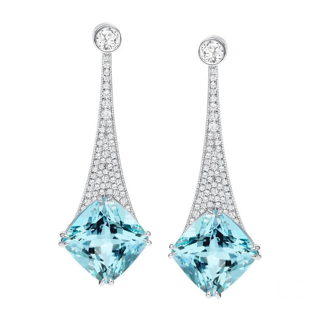The name “aquamarine” is derived from two Latin words: aqua, meaning “water,” and marina, meaning “of the sea.”

17.96 carats of soothing Aquamarines are the stars of these glamorous 18K white gold earrings. Two rose-cut diamonds weighing 0.39
