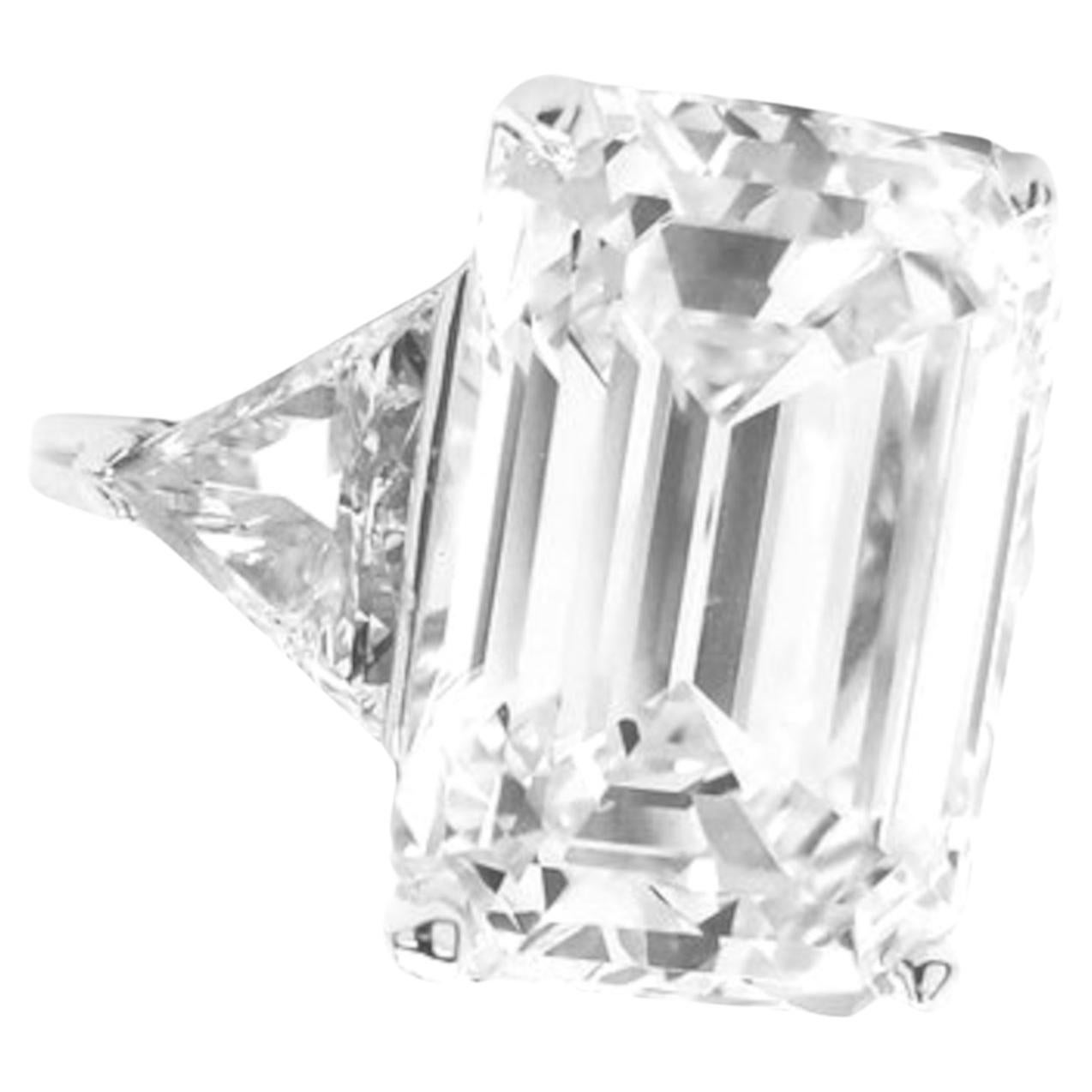 luxurious masterpiece featuring a stunning 18-carat Flawless Clarity I Color Emerald cut Diamond, certified by GIA. This exquisite diamond boasts excellent polish and excellent symmetry, with faint fluorescence, ensuring maximum brilliance and