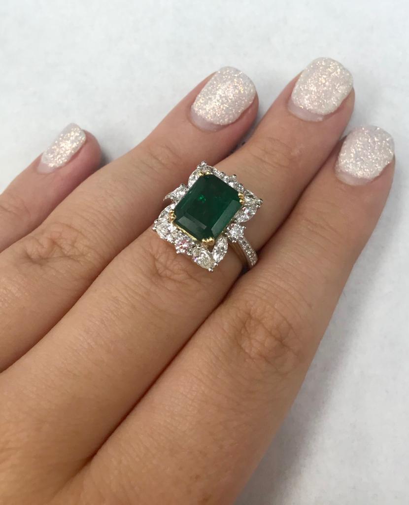 GIA Certified 18 Karat Gold Emerald Cut Emerald and Genuine Diamond Ring
4.10 Carats of Emeralds
1.50 Carats of Genuine Diamonds
18 Karat Gold (Both White and Yellow)
Emerald Cut 
GIA Certified 