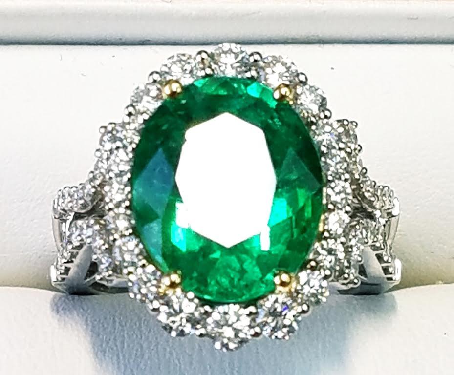 GIA Certified 18 Karat Oval Cut Emerald and Diamond Ring
6.83 Carats Oval Emerald (13x11mm)
1.14 Carats of Baguette Cut Diamonds 
Oval Cut
18 Karat White Gold
GIA Certified