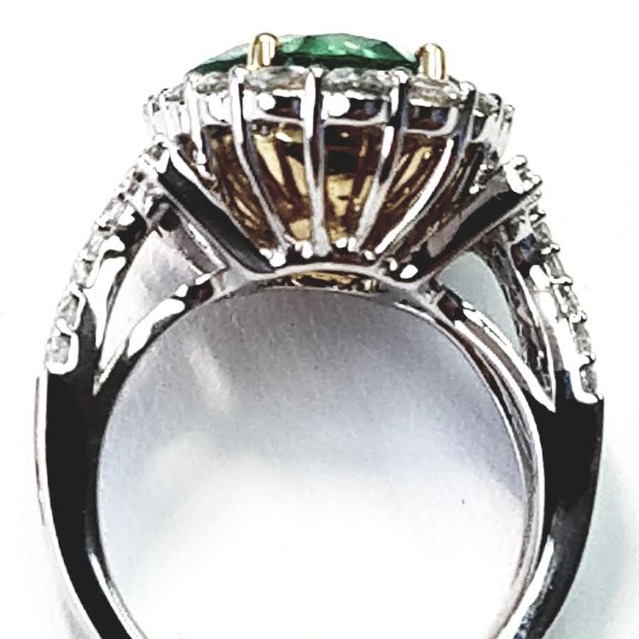 Emerald Cut GIA Certified 18 Karat Oval Cut Emerald and Diamond Ring