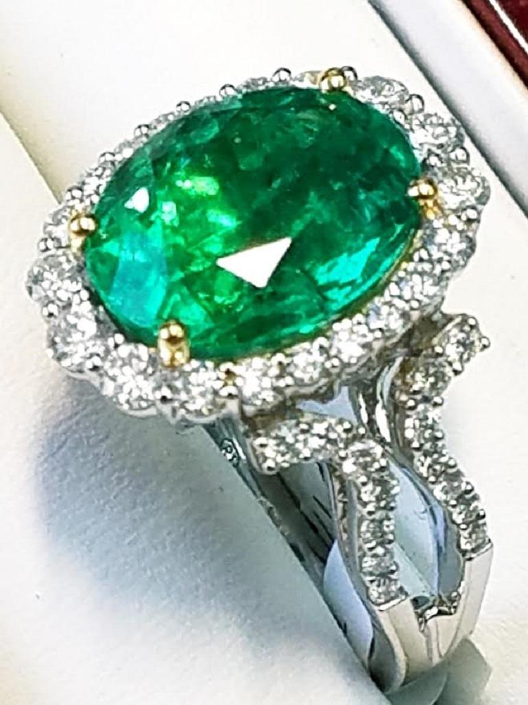 Contemporary GIA Certified 18 Karat Oval Cut Emerald and Diamond Ring
