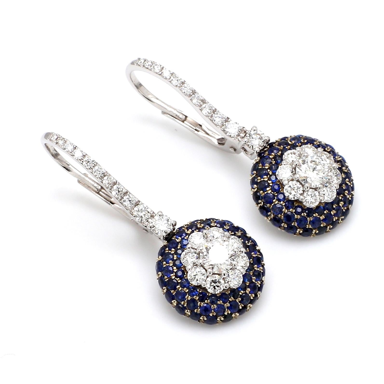 A Beautiful Handcrafted  Earring in 18 karat White Gold with Natural Brilliant Cut Colorless GIA Certified Round Diamond And AAA Cut Round Blue Sapphire Gemstones. A Statement piece for Evening Wear totaling 1.82 ct of Diamonds & 2.16 Carat of