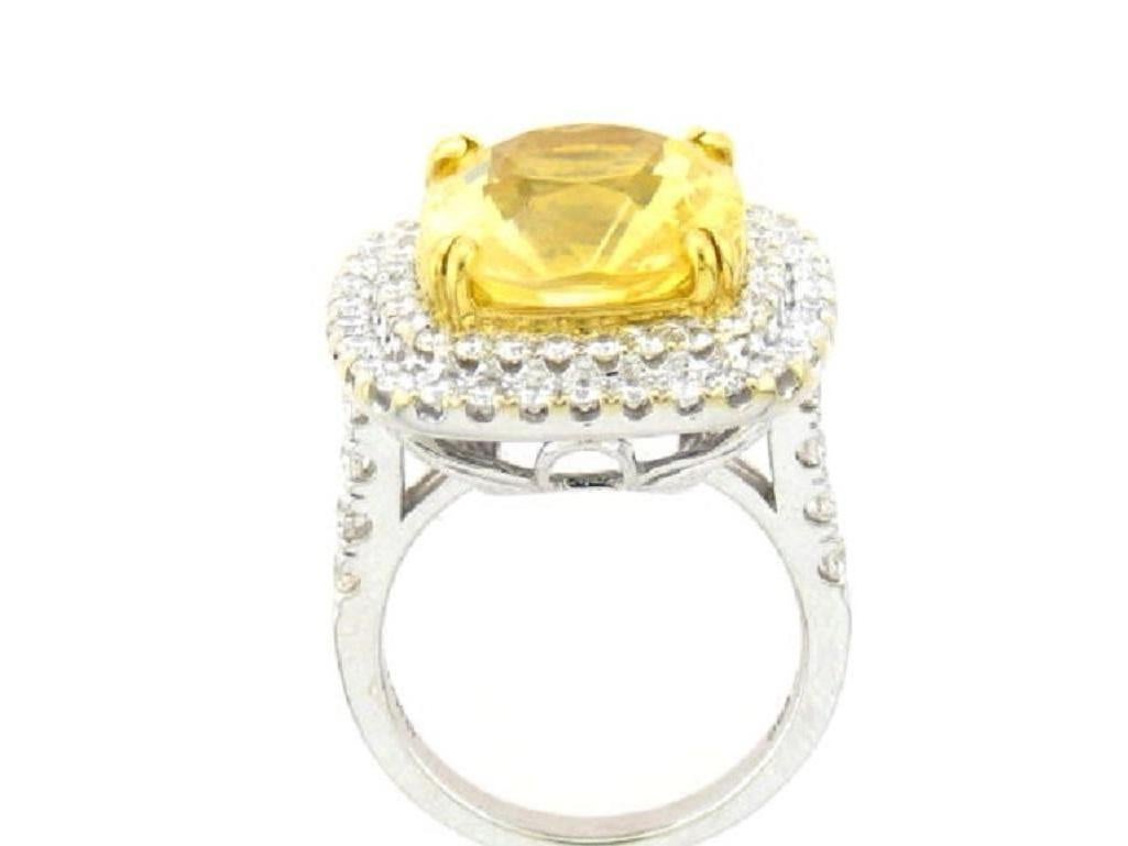 GIA Certified 18k White Gold Cushion Cut Yellow Sapphire and Diamond Ring
12.63 carats of Yellow Sapphires
1.52 carats of Diamonds
Cushion Cut
18k white gold 
GIA Certified
Natural, NO HEAT