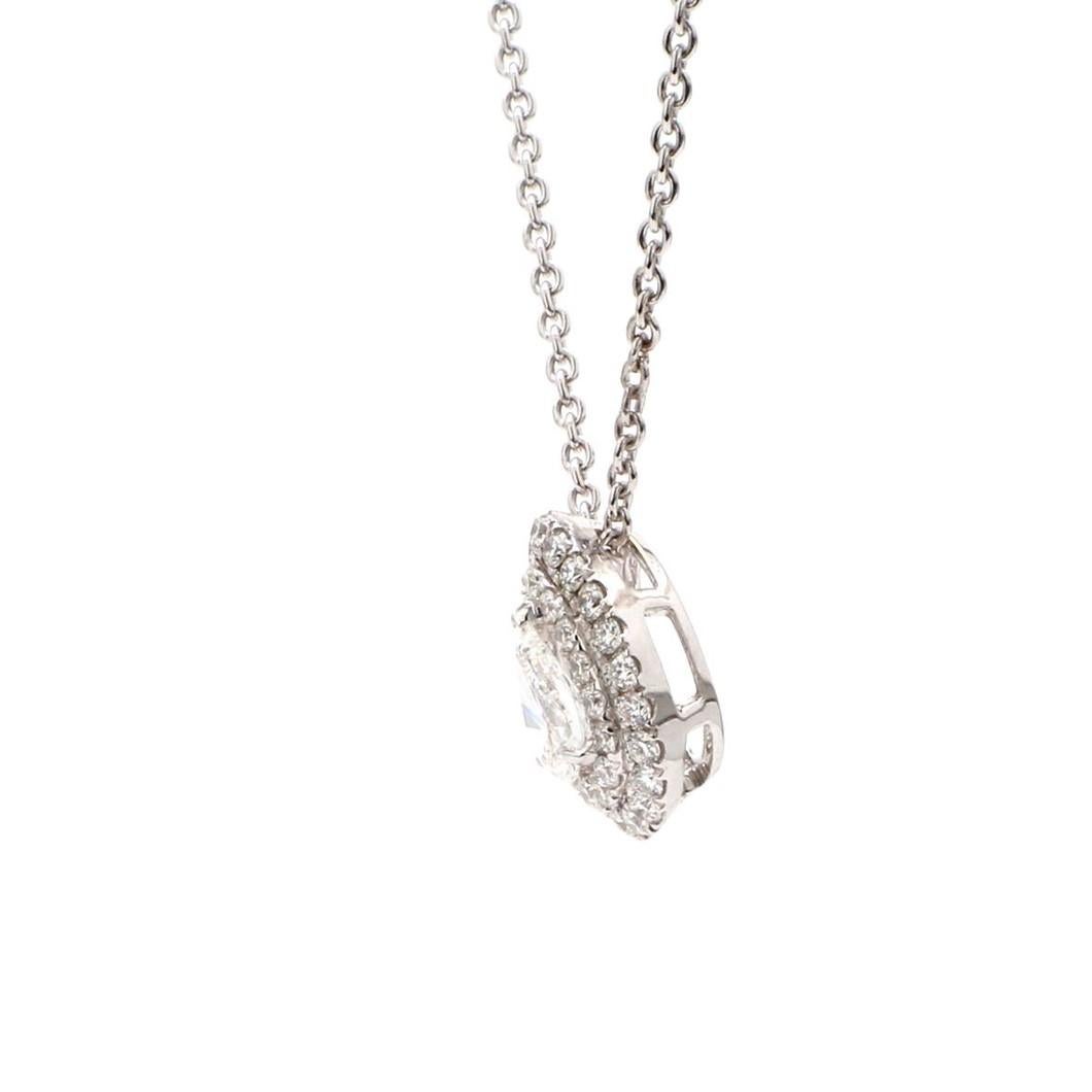 A Beautiful Handcrafted Necklace in 18 Karat White Gold with Natural & Ethically Mined GIA Certified 1/3 Carat (0.35) Pear Cut Diamond  in a Double Halo Diamond Necklace with 18