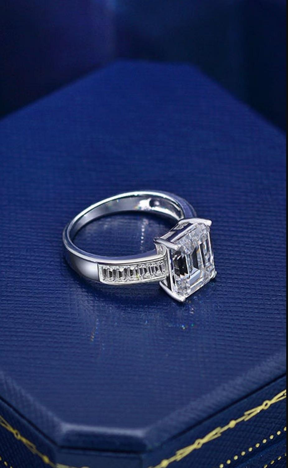 This ring exudes class ans sophistication the main stone has the perfect proportions and ratio.