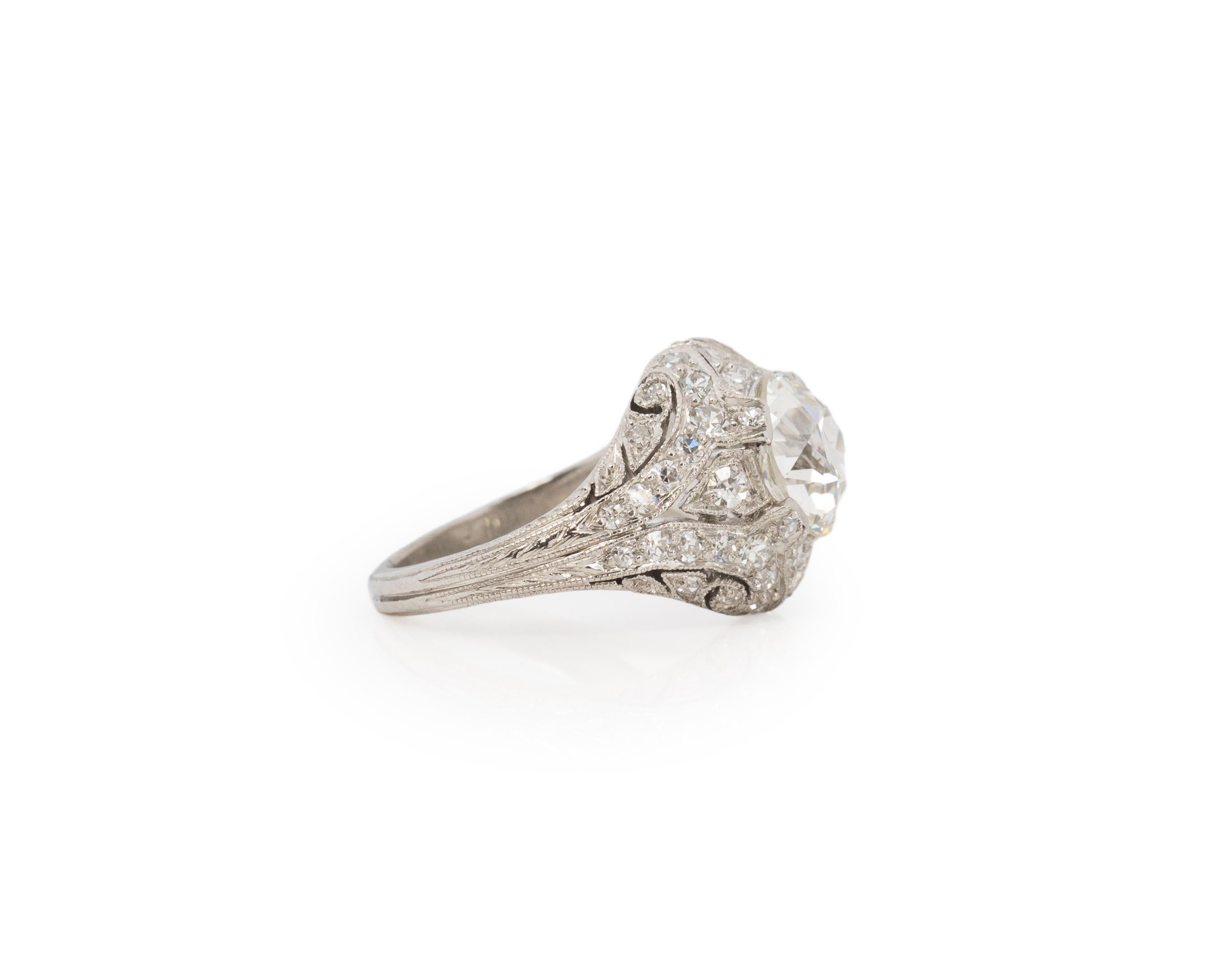 Ring Size: 3
Metal Type: Platinum [Hallmarked, and Tested]
Weight: 6.3 grams

Center Diamond Details:
GIA LAB REPORT #:2457886222
Weight: 1.80ct
Cut: Old European brilliant
Color: J
Clarity: VS2
Measurements: 7.63mm x 7.39mm x 4.92mm

Side Diamond