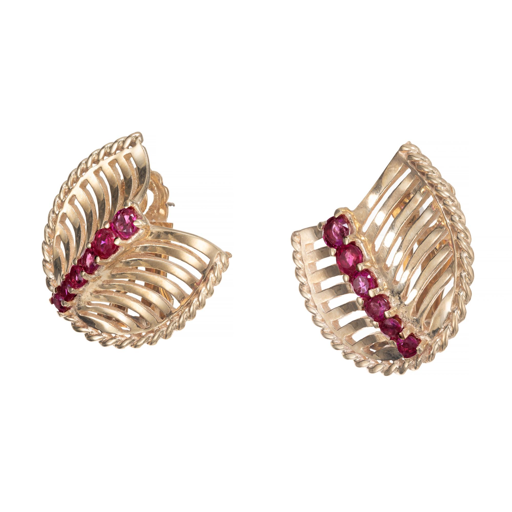 Unique vintage 1950's ruby yellow gold earrings. These mid-century 14k yellow gold fan style earrings are each adorned with a row of 6 graduated rubies. GIA has certified these as natural, no heat round sapphires. They have a clip post back to them.