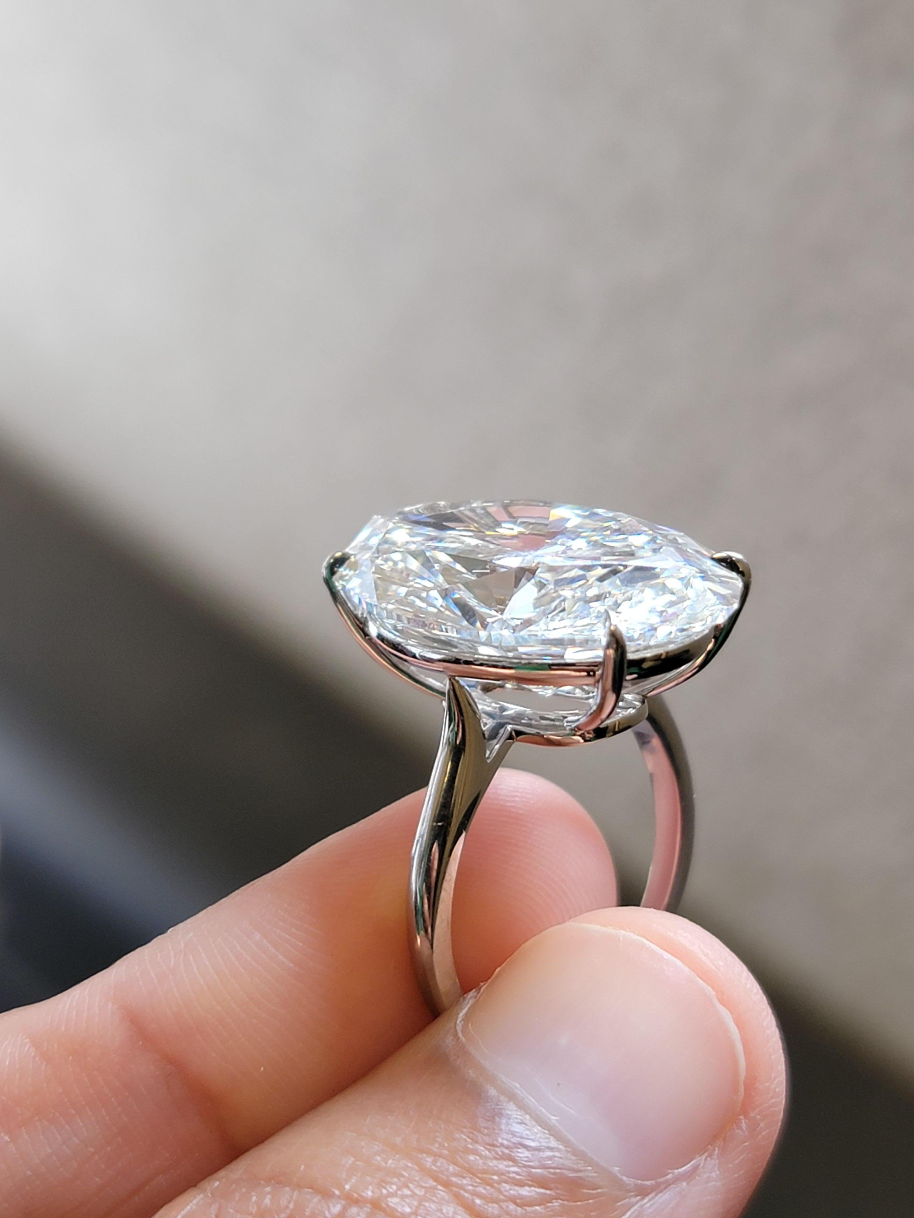 Imagine capturing a moment that lasts a lifetime with this stunning, 18K WG  18 Carat  Natural Oval Shape Diamond Ring. The diamond is near colorless,(GIA Certified H color VS1 clarity). Its exquisite Brilliance and captivating design make it a true