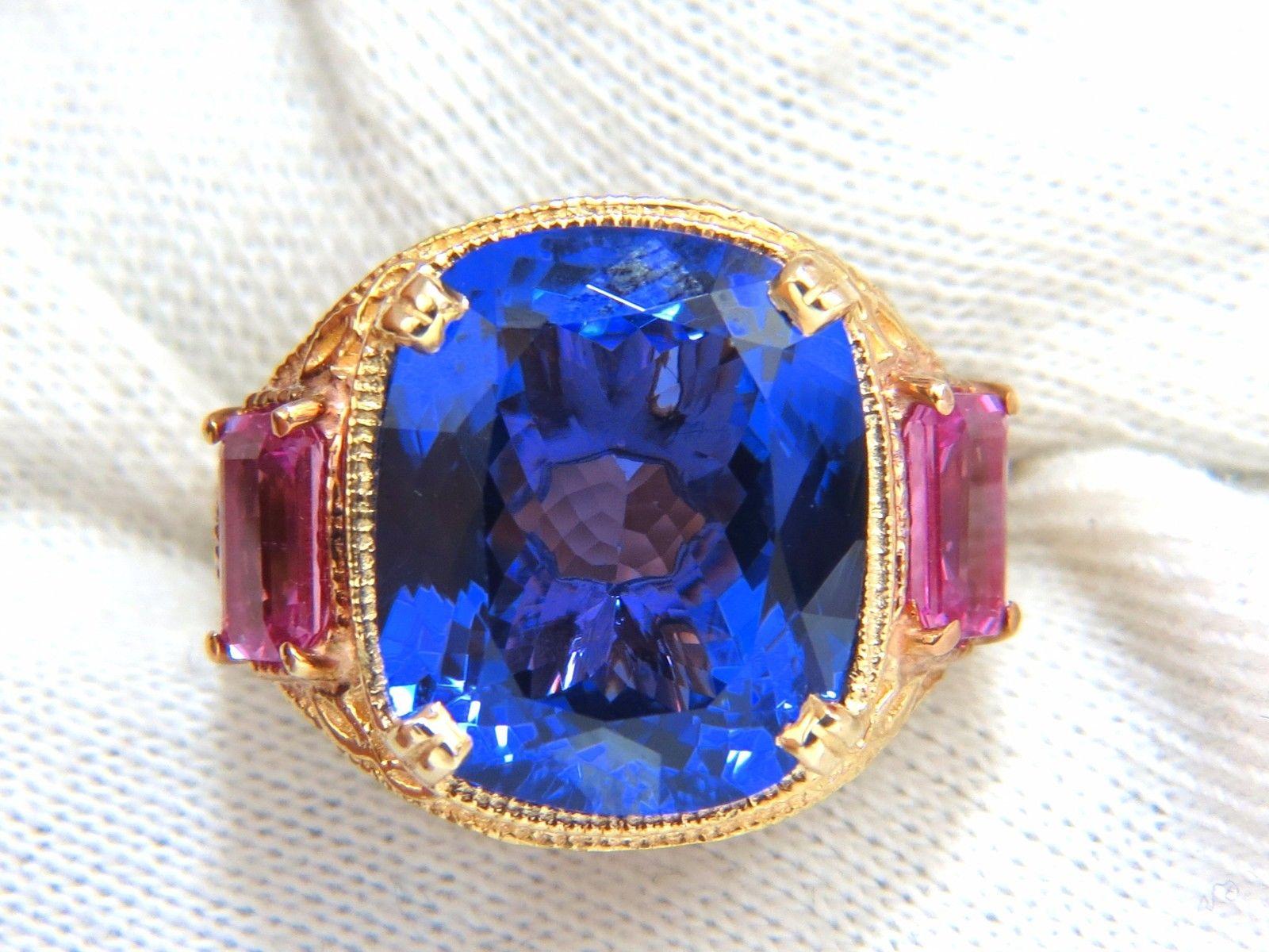 Blue's & Pinks, Tanzanite Glamour Class Ring.

13.01ct. Natural tanzanite

Cushion cut

Excellent vivid violetish blue tone

Measures: 16.35 X 13.70 X 7.46mm

VVs- clarity

Full cut and brilliant sparkles 

GIA Report #2165669043 will