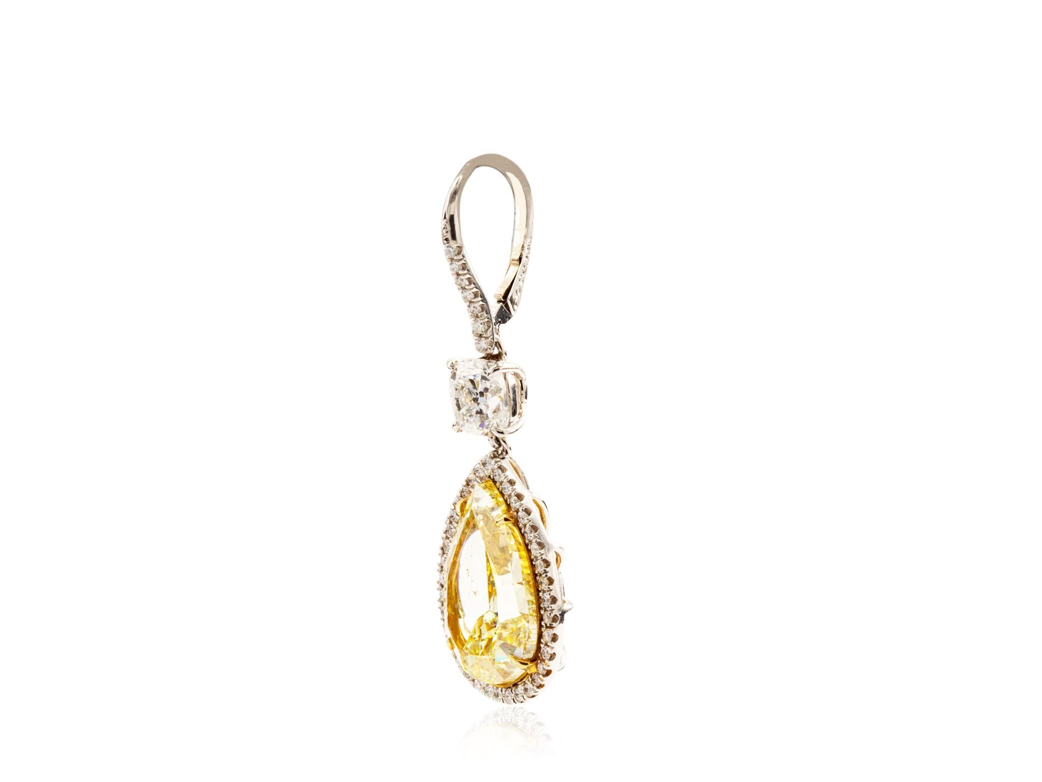 18 karat yellow gold and platinum custom designed by Shreve Crump and Low Canary Yellow Pear Shape Diamond drop earrings. Consisting of 2 PS diamonds weighing 18.09 carats total weight accompanied by GIA certificates FY/SI1 dropping from a pair of