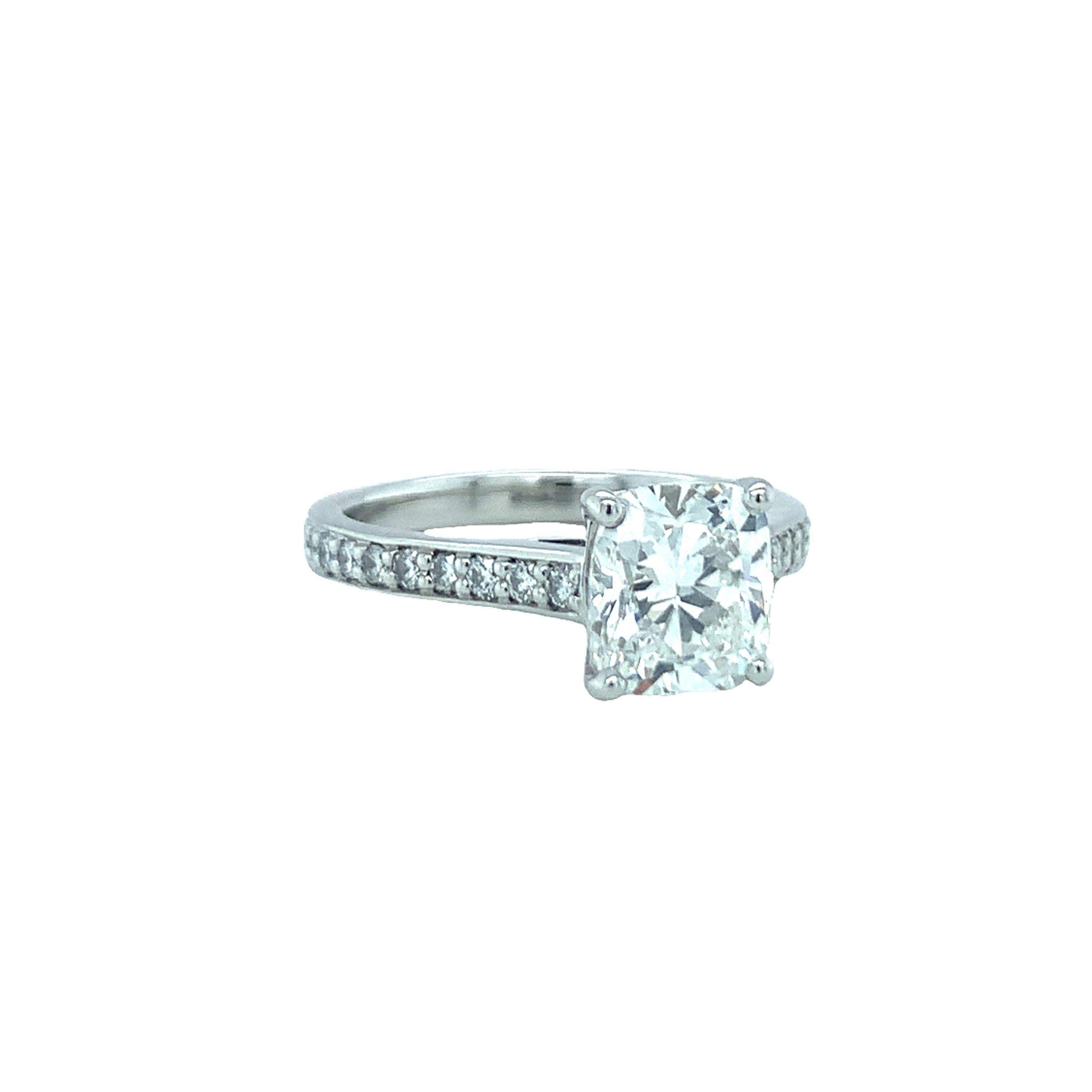 One GIA certified 1.81 ct. diamond platinum engagement ring centering one prong set, cushion modified brilliant diamond weighing 1.81 ct. with GIA cert stating G color and SI-1 clarity. Enhanced by 43 bead set, round brilliant cut diamonds totaling