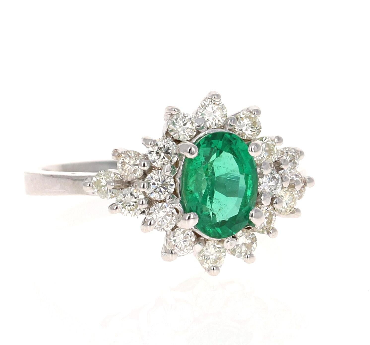 Stunning Oval Cut Emerald Diamond Cluster Ring! 

This Emerald ring has a gorgeous unique look. The center oval cut Emerald is 1.10 Carat and has a cluster of 18 Round Cut Diamonds weighing 0.71 Carats that surrounds it. 
The clarity and color of