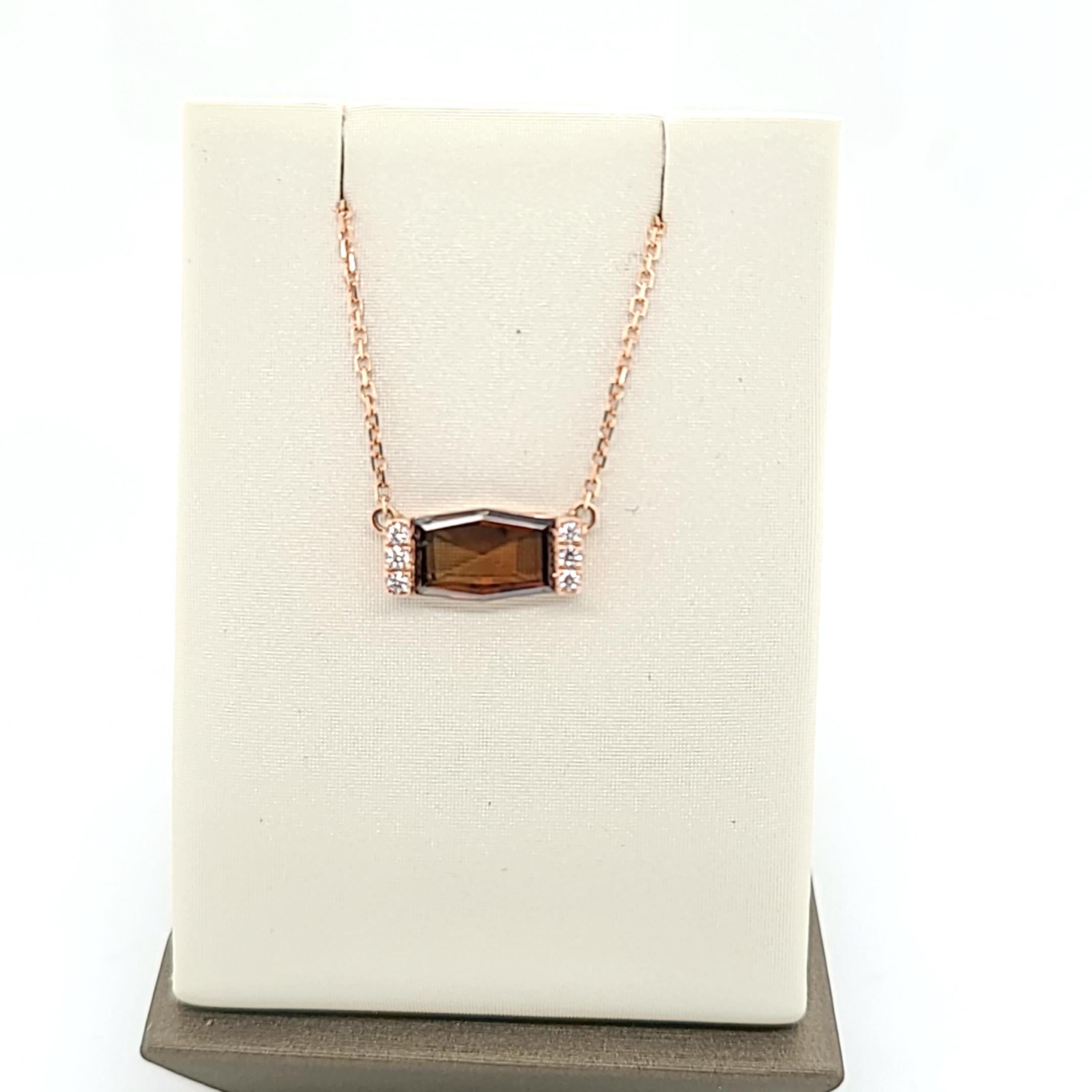 Make a captivating statement with this handcrafted hexagon diamond pendant, featuring a mesmerizing GIA Fancy Dark Orangy Brown Hexagon Diamond, certified with the unique number 1106636466. The distinct hexagon shape of the diamond adds a modern and