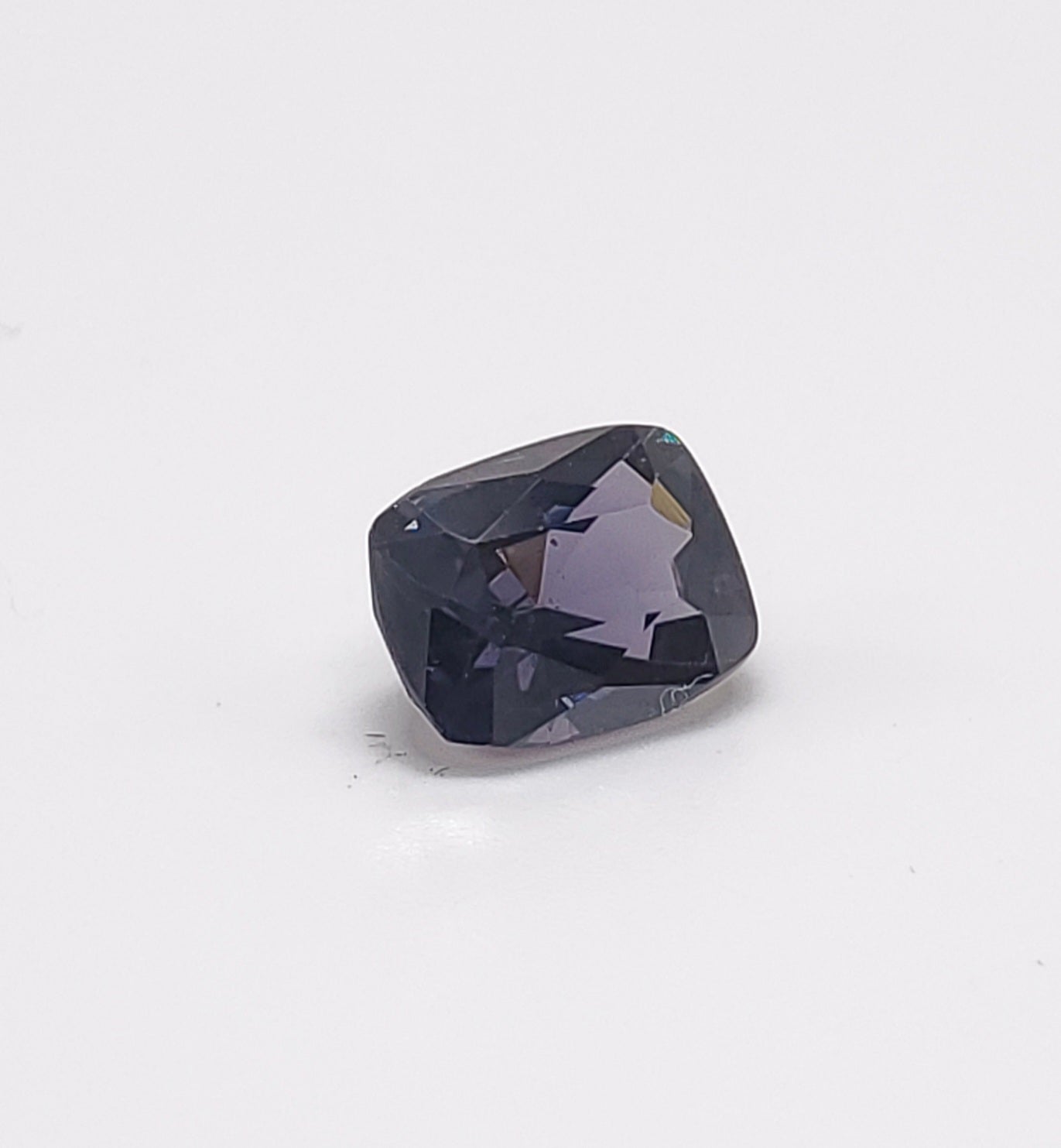 This pretty Purple spinel Cushion cut , weighs 1.81 carats and would make a beautiful 3-stone ring, though its shape lends itself to a variety of possibilities! It measures 8.09 x 6.11 x 4.53 millimeters, is eye clean, brilliant, and well-faceted,