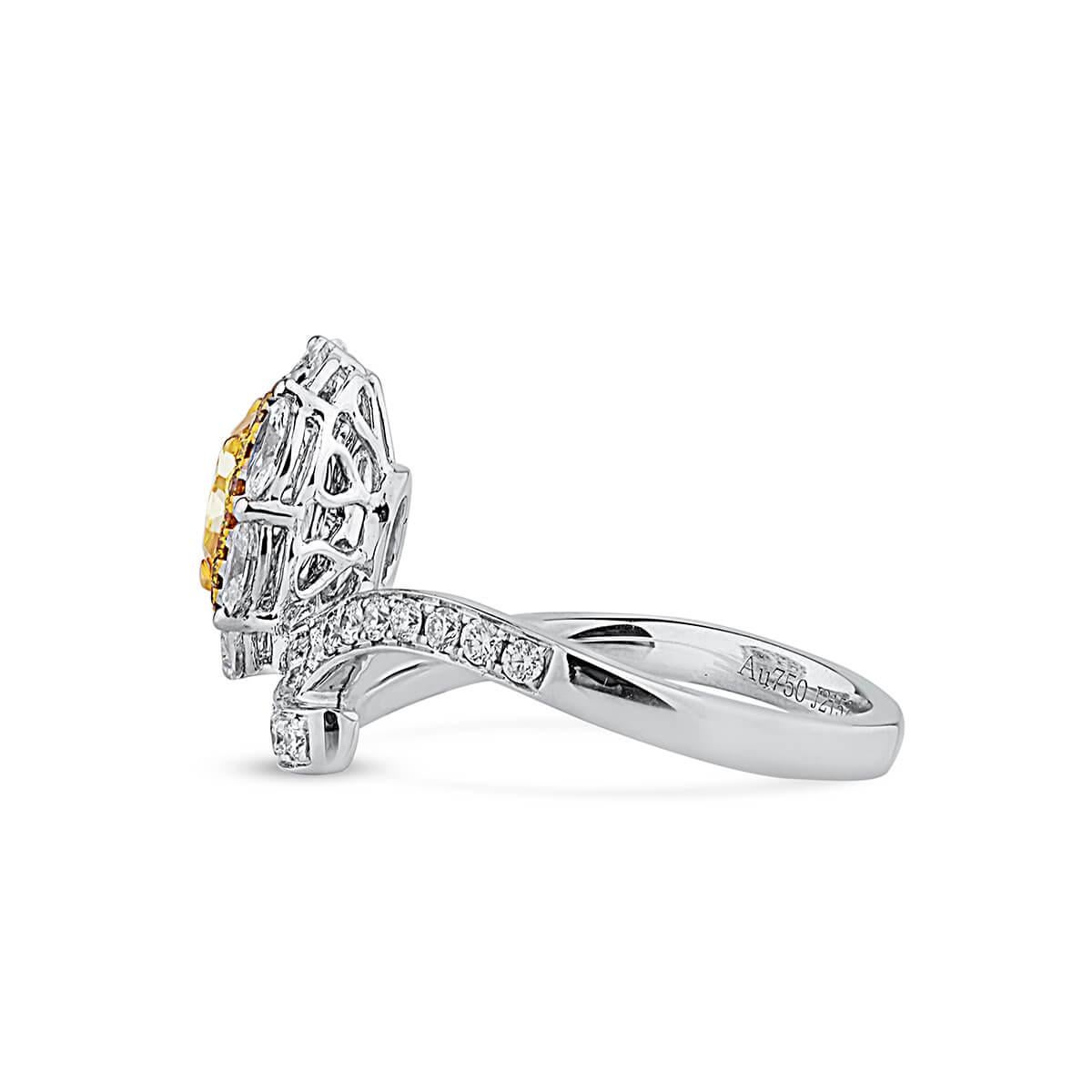 This one of a kind piece hosts an incredible main natural 0.91 carat fancy intense yellow cushion shape diamond. Beautifully complimented by smaller natural white diamond making up a total carat weight of 1.82. This piece is GIA certified and has