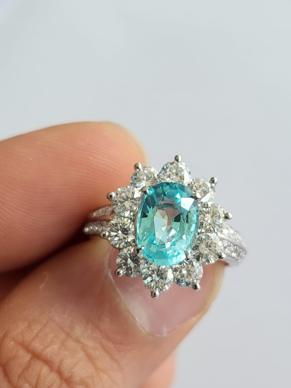 A very gorgeous and stunning, Paraiba Tourmaline Engagement Cocktail Ring set in Platinum 900 & Diamonds. The weight of the Paraiba Tourmaline is 1.83 carats. The Paraiba Tourmaline is completely natural, without any treatment and is of Mozambique