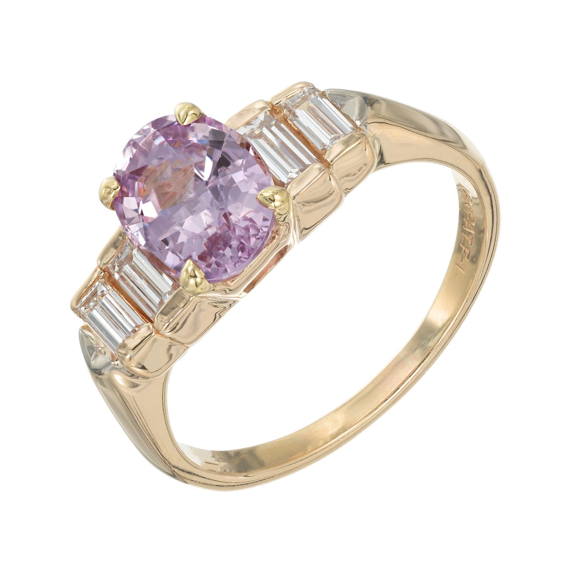 1960’s sapphire an diamond engagement ring. GIA certified oval sapphire center stone with baguette side stones in a 14k yellow gold setting. 

1 oval pink-purple sapphire MI, approx. 1.84cts GIA Certificate # 6203642916
4 straight cut baguette