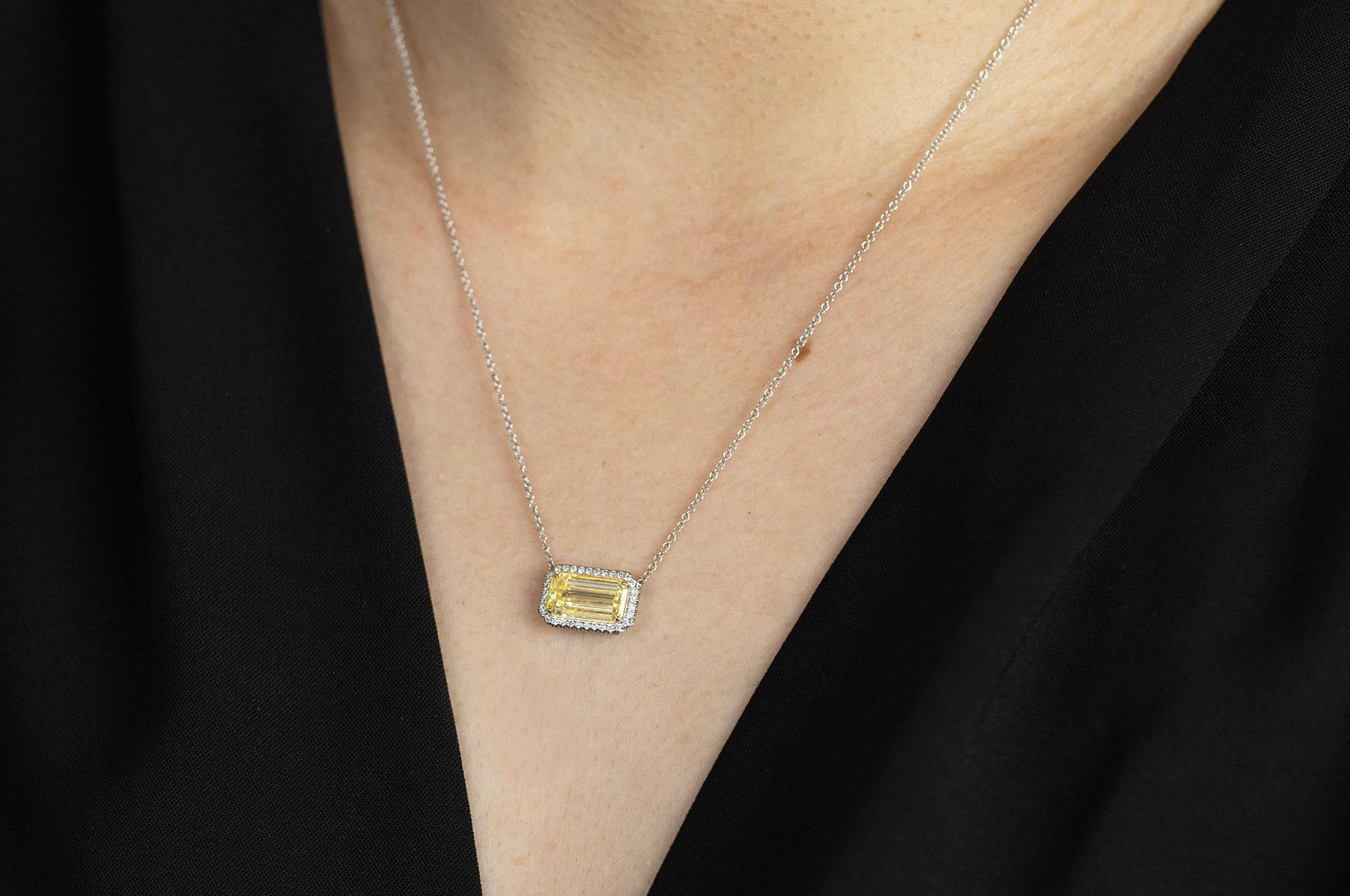 Contemporary GIA Certified 1.86 Carats Emerald Cut Yellow Diamond Halo Pendant Necklace For Sale