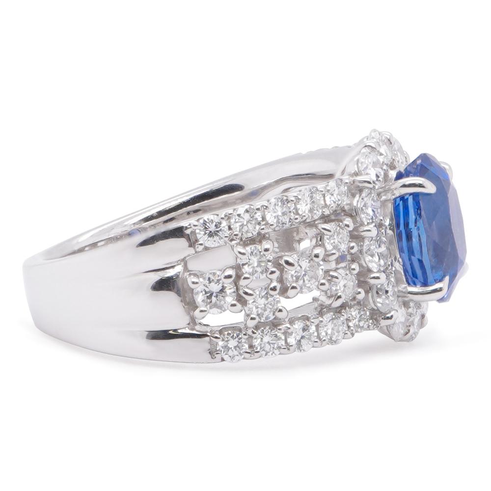 Burma sapphires are among the rarest and most valuable types of sapphires, courtesy of their stunning royal blue color. This ring has a GIA certified 1.87 carat No heat sapphire from Burma. The stone is flanked by 1.17 carat of white brilliant round