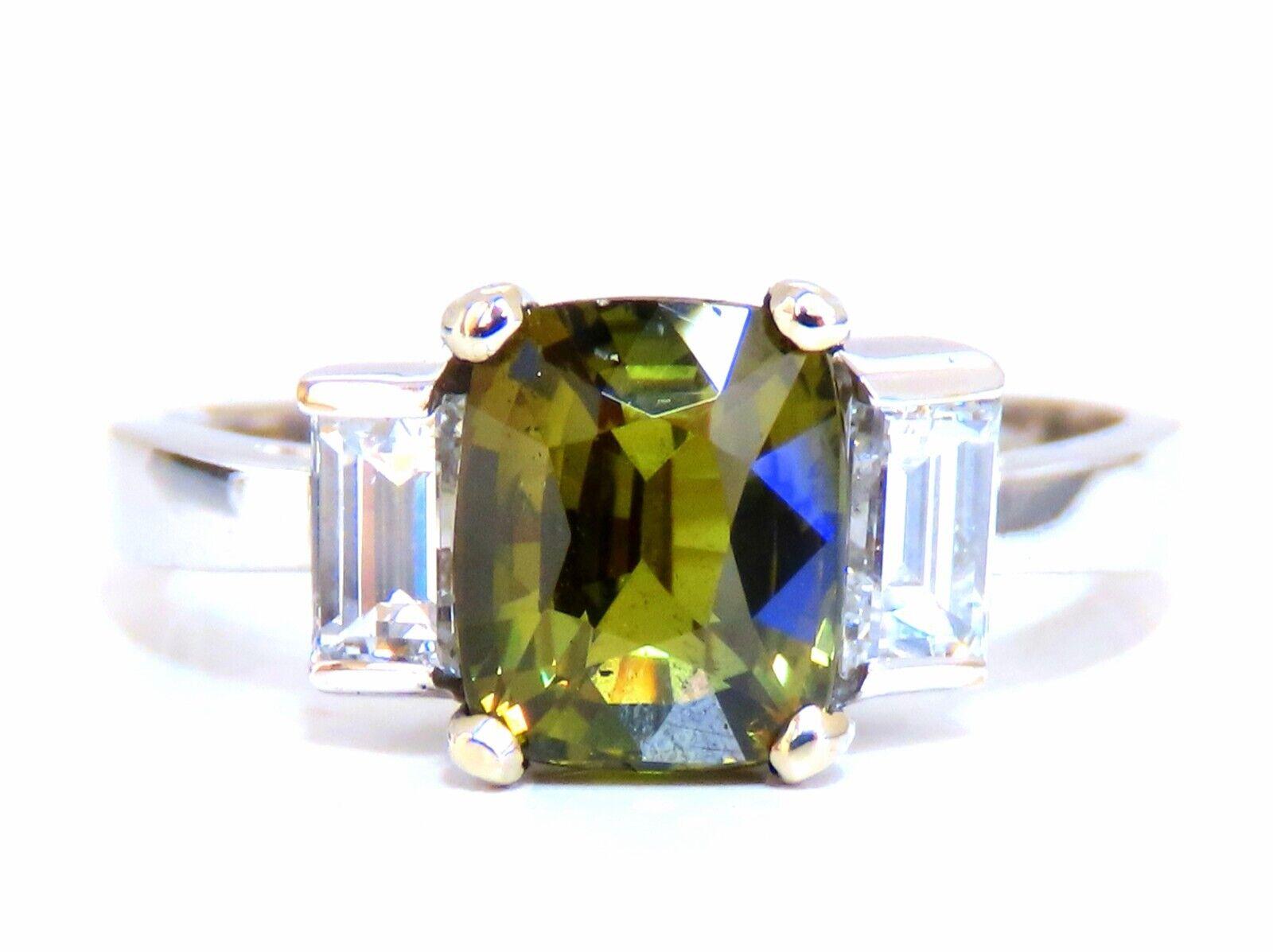 GIA certified natural 1.87 carat color change alexandrite ring.

Certificate #1206895030

Measures 7.64 X 6.30 x 4.25 mm.

Transparent, yellow green changing to yellow.

Cushion cut - clean clarity.


.56 carat natural diamonds.

G color vs2